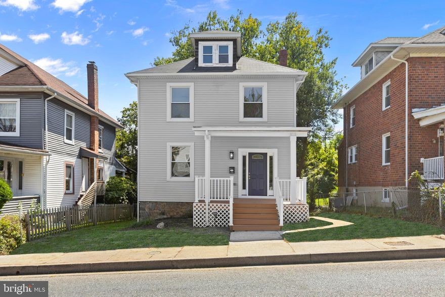 Welcome to this beautifully renovated 5-bedroom, 3.5-bath home offering charm, space, and modern updates in the Winston-Govans area of Baltimore City. With a prime location near Loyola University Maryland, MedStar Good Samaritan Hospital, Mount Pleasant Golf Course, and Northwood Commons Shopping Mall, this property offers convenience for both daily living and investment potential. Step onto the inviting covered front porch before entering a bright, open interior featuring luxury vinyl plank flooring and fresh paint throughout. The main level boasts a primary bedroom with an attached full bath, a spacious living/dining area, a convenient half bathroom, a stunning new kitchen with white shaker-style cabinets with soft-close doors, quartz countertops, a stylish backsplash, and stainless steel appliances, and a laundry room with washer/dryer hookup.  Upstairs, you’ll find four generously sized bedrooms and a full bathroom, perfect for family or guests. The finished attic level adds incredible versatility with its own private full bathroom, making it an ideal second primary suite, home office, or guest retreat. The possibilities are endless. The home also features an unfinished basement, offering plenty of storage space or potential for future customization. Outside, enjoy the privacy of the backyard — great for gatherings, play, or pets. The rear covered porch is a convenient way to enter the home into the kitchen from the outside. This home blends thoughtful updates with functional living spaces, making it a fantastic opportunity for families, students, or savvy investors. Move-in ready and beautifully updated, this Winston-Govans gem won’t last long! Updates include: new roof (2025), new HVAC (2025), new water heater (2025), all new windows (2025), brand new appliances (2025), upgraded electrical panel (200 AMP).