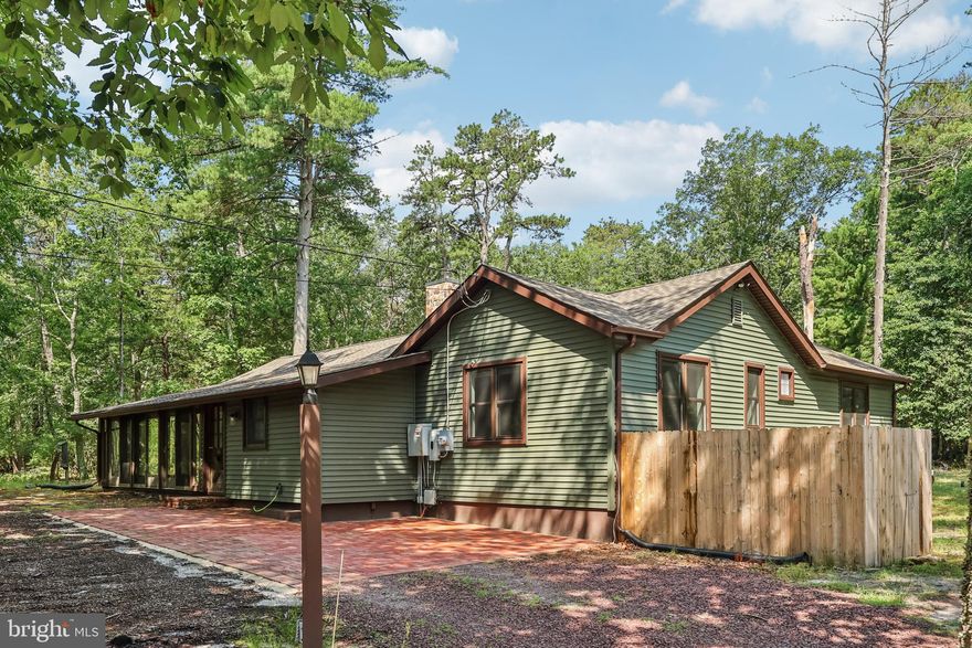 Welcome to 1322 Stokes Road, a rare 7.1-acre wooded retreat tucked privately off the main road in the heart of Medford. This unique property features a charming 3-bedroom cottage with rustic character, a spacious detached barn, and endless potential for expansion or customization. Set across from YMCA Camp, the home offers a peaceful, nature-filled setting with mature trees, privacy, and plenty of room to roam—all while still being minutes from downtown Medford, schools, and major routes. Whether you're looking for a peaceful primary residence, a weekend escape, or land with potential, this one-of-a-kind parcel combines rustic charm with endless possibilities.
