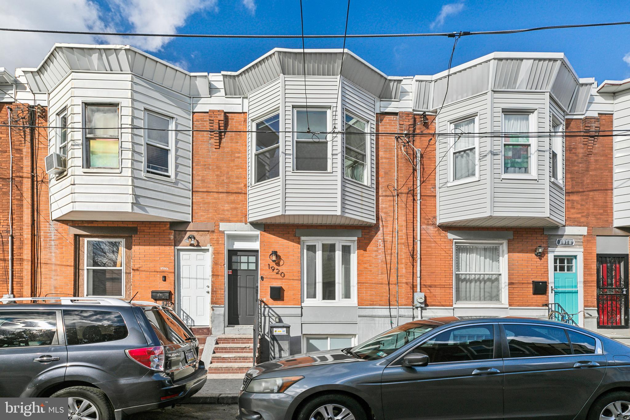 Welcome to 1920 S Woodstock Street, a beautifully renovated 3-bed, 1.5-bath home in Point Breeze featuring a bright open floor plan and modern finishes throughout.
The spacious first floor, complete with half bath, boasts hardwood floors, recessed lighting, and a seamless flow between the living, dining, and kitchen areas. This home is equipped with smart features, including an electronic front door keypad, Google Nest doorbell, Google Nest thermostat, and Lutron Smart Light system with a hub—allowing you to control the lights via an app or voice commands.
The chef’s kitchen is equipped with quartz countertops, white shaker cabinets, a stylish chevron backsplash, and stainless steel appliances, including a French door refrigerator, six-burner gas range with overhead vent hood, dishwasher, and a deep steel basin sink with a black gooseneck faucet. An elevated breakfast bar and dining area sit beside sliding glass doors leading to a large backyard—perfect for entertaining. The finished basement offers extra living space, a side-by-side washer and dryer, and ample storage.
Upstairs, the primary bedroom is bright and airy with oversized bay windows and deep built-in shelving between two closets. The rear bedroom enjoys abundant natural light from windows on two sides and features a closet with sliding doors. The center bedroom is ideal for a home office or guest space. The full bathroom includes a floating vanity with storage, an LED-backlit mirror, and a shower/tub combo with a built-in niche shelf for convenience.
Conveniently located near Geno’s & Pat’s Steaks, the Italian Market, Passyunk Square, and major highways, this home provides easy access to Center City, the airport, and top Philly attractions.
Don’t wait—schedule your showing today!