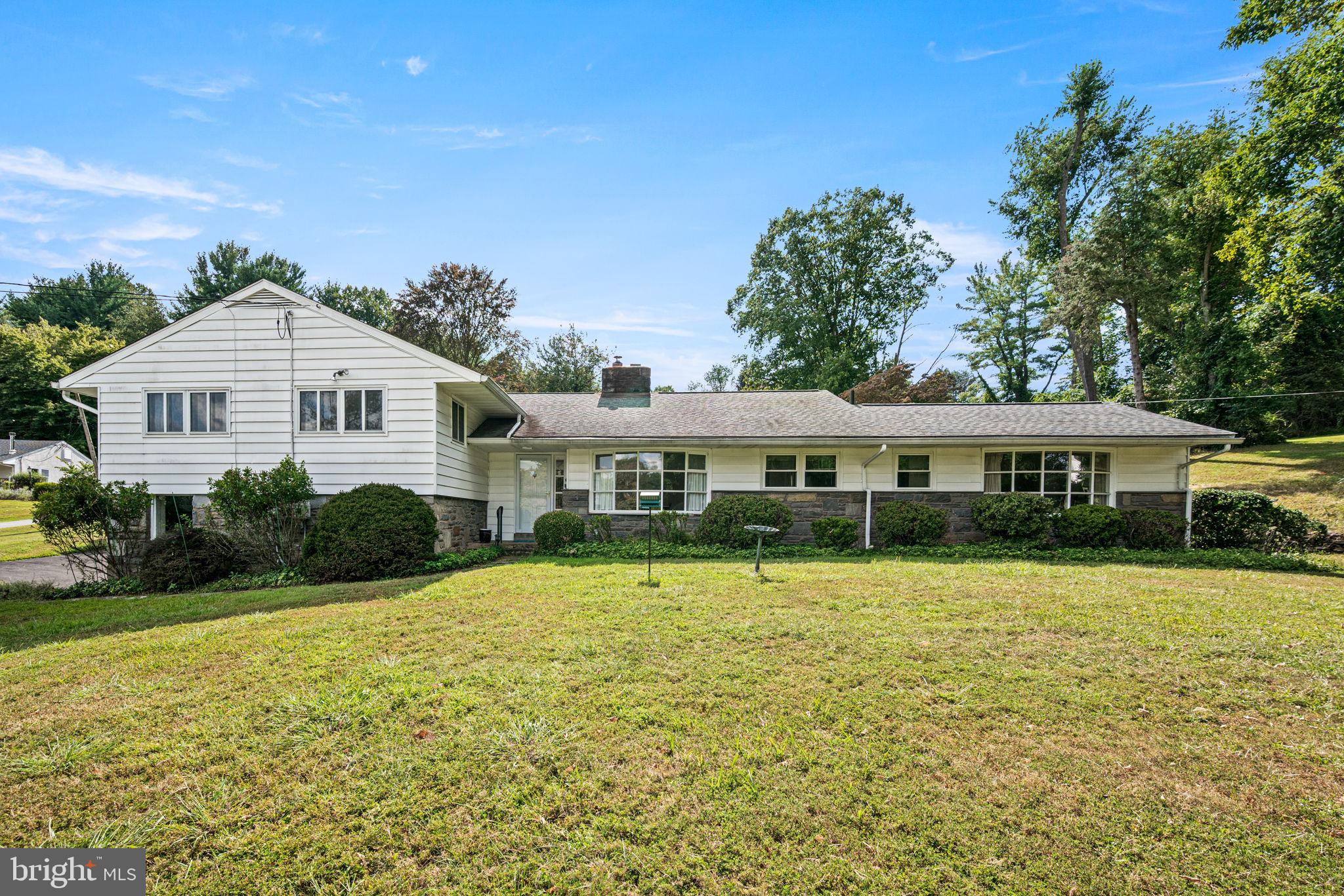 Welcome to 311 Timber Jump Road, set on a beautiful, rolling lot in the highly desirable Rose Tree Media school district. This spacious 4 bedroom, 3.5 bath split-level home offers over 2,300 square feet of living space filled with charm, privacy, and endless potential. Lovingly maintained by its owner, this home is move-in ready and simply awaits your personal touch.
The main level features a welcoming layout highlighted by a primary bedroom with an en-suite full bath, a formal dining room, and a spacious family room with built-ins and a wood-burning fireplace. Sliding glass doors lead you out to the gorgeous landscape of nearly an acre of land with mature trees, established shrubbery, and expansive lawns. There is ample opportunity to garden, play, or simply unwind while enjoying the natural setting.
Upstairs, you will find three additional bedrooms—one with its own en-suite full bath, along with another full bath in the hallway. The walk-up attic is fully floored, providing abundant storage and the potential to be finished into additional living space.
The lower level provides flexibility with room for an office or den, laundry area, and a half bath with direct access to the garage. A spacious full basement offers excellent storage and the opportunity to expand with even more living space.
Additional features include a full-house generator, providing peace of mind and comfort year-round.
With its serene setting just down the street from Paxon Hollow Golf Club, this home offers a rare combination of space, privacy, and convenience. Close to all Media has to offer, including shops, restaurants, a vibrant downtown, and easy access to the Blue Route.