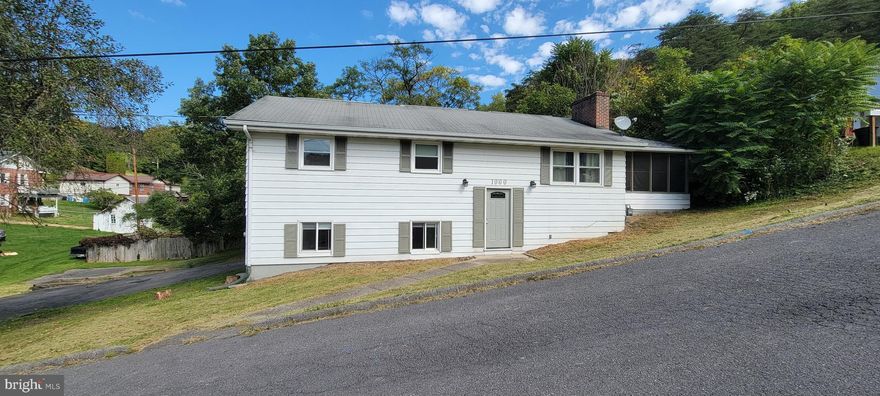 Welcome to 1000 Shades Lane! Need extra space? Pack your bags and move right in! This home features 4 bedrooms, 2 bathrooms, a separate dining room, an open living room with a brick wood burning fireplace, and an additional rec room in the basement. The attached garage offers parking for at least one vehicle and room for storage as well as a utility and laundry area. Enjoy time on the screened-in porch or back patio. Entertain in your private, fenced-in backyard while swimming in the above ground pool. Plenty of off-street parking. Brand new windows throughout the home too! Schedule your showing today!