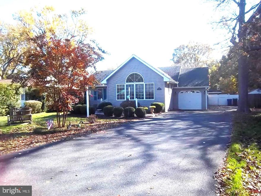 More than meets the eye from the street. Cathedral ceilings, hidden screens, family room easily converted to a guest suite with a gas fireplace and full bath. Fenced back yard with large deck, power awning, pool surrounded by banana trees in the summer (as long as you remember to cut back and cover in the colder months) large shed/shop plus additional shed for storage.  Lovely front yard lanscaped for birds and privacy.  Just off a main street on a dead end street, easy walk to amenities including the VFW, Amish Market and other shopping and easy walk downtown. Plenty of parking on the large paved drive and deep garage. Well maintained with a fully encapsulated crawl space and attic storage. Just under 1,900 Sq. FT.  Listed as a 2 bedroom but easily converted to 3 with two full baths, one with exterior access to the deck and pool. Don't let this one slip away!