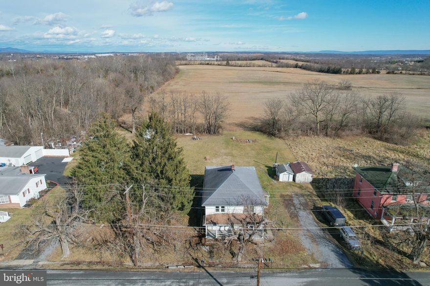 INVESTORS, HERE IT IS! This 3 unit triplex has two current occupied units and a third unit waiting for the new landlord to take the reigns.  This house boasts three separate units. The house is on two separate parcels on almost an acre.  Very private with pasture land views.  There is separate electric in the back portion of the yard which was used in the past for an RV hookup.  There is significant opportunity to increase the value of the house and the apartments with some imagination and elbow grease. Don't let this investment opportunity pass you by, book your showing today.