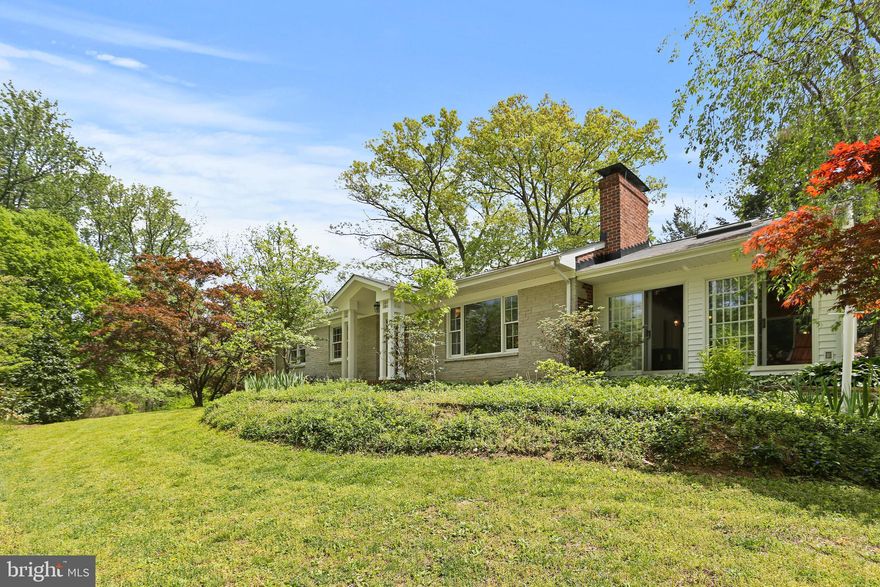 Welcome to this exceptional brick 4 bedroom, 3 bathroom home, ideally located in the heart of Clarksville with rare privacy, stunning natural surroundings, and boundless options. Set on a picturesque 1.1 acre homesite and bounded on two sides by protected parkland, this property offers a tranquil, resort-like atmosphere with breathtaking views of a great variety of flowering trees, shrubs, a stream, and an awesome backyard with access to miles of trails — a true paradise for nature lovers and outdoor enthusiasts. And a short private path connects the property to the Pheasant Ridge Community.  
Thoughtfully upgraded inside and out, the home features a new roof (installed 11/2023 with transferable warranty) with all new flashing, a circular driveway, oversized two-car carport, extensive landscaping, stacked stone retaining walls, spacious bluestone patio and a large deck off the kitchen perfect for entertaining.
Inside, enjoy hardwood floors throughout, a masonry fireplace, renovated bathrooms, and a charming 7 sliding-door sunroom with cathedral and beamed ceilings, and a pellet stove. The kitchen showcases beautiful views through an elegant Palladian window wall. Upgraded Andersen windows and doors throughout, and three operating skylights further illuminate the home. Major upgrades also include connection to public water and sewer, a recently installed high-efficiency Bosch/Buderus natural gas boiler with baseboard heat and hydronic towel warmers in the bathrooms, and a reverse osmosis water filtration system in the kitchen.
The amazing daylight walkout basement features a sizeable bedroom with full windows for the panoramic views of the backyard, a remodeled full bathroom,  a big flex room or home office, and large recreation room with 8’ wide glass slider to expansive blue stone patio, adding wonderfully bright living space. 
The custom designed front porch enhances the home’s curb appeal.
The stream within the property presents other great options for relaxation and enjoyment – reading books at the bank or listening to the sound of water falls and song of the birds while planning your organic gardens near the water in your private oasis.   
Zoned R-20, this property offers plenty of flexibility: subdivide into two premium lots, build an in-law cottage, or create space for a home-based business. Columbia Association (CPRA) membership is only $3/month while you are close to all the community amenities. Top-rated schools (Clarksville ES & MS and River Hill HS), parks, shops, gyms, pools, various restaurants, medical services, and major commuter routes are just minutes away.
Don't miss this rare opportunity to own a unique home with privacy, character, and the ability to offer many options in one of Clarksville's most sought-after locations!