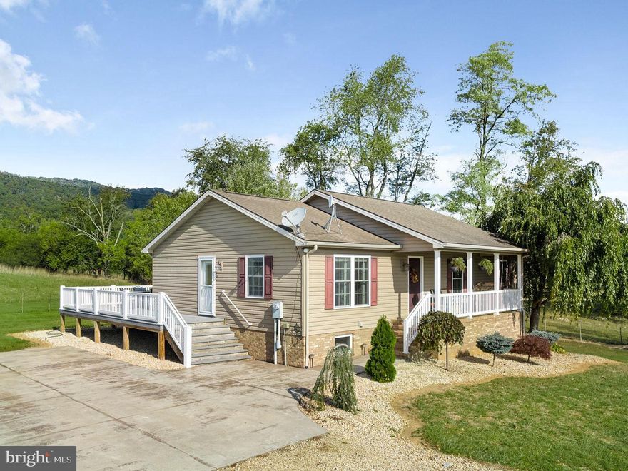 Escape to your very own country oasis where privacy and tranquility await. This idyllic property is a haven for those seeking the serene beauty of the countryside and the majesty of mountain views.

As you enter via the long driveway, you'll immediately appreciate the perfectly maintained ranch-style home. The charming landscaping and expansive concrete parking lot offer both convenience and curb appeal.

One of the highlights of this property is the L-shaped deck with low-maintenance Trex decking, an ideal space for entertaining or simply basking in the breathtaking mountain vistas. There's ample room for outdoor furniture and a front porch swing to savor the views in the opposite direction.

Step inside, and you'll fall in love with the open floor plan concept. The kitchen features an island, stainless steel appliances, and a pantry adjacent to the dining area. Sunlight floods the spacious living room, highlighting the beautiful hardwood floors throughout the main level, while the kitchen boasts elegant tile flooring.

This home offers four bedrooms and three full baths across approximately 2,500 finished square feet. Upstairs on the main level, you'll find three bedrooms and two full bathrooms, each exuding warmth and comfort.

The lower level houses a spacious primary suite with an attached full bathroom, offering an intimate retreat. Additionally, there's an extra room perfect for another family room or media room.

The property also boasts a versatile outdoor building that was once a chicken house and has been transformed into a workshop, storage area, run-in shed, and utility room with a sink, all under a sturdy metal roof.

This property is a true gem, offering a harmonious blend of peaceful living, pristine surroundings, and an array of practical amenities. It's only 6 minutes to the Town of Broadway and only 15 minutes to I-81! Don't miss the opportunity to make this countryside dream your reality. Schedule a viewing today!