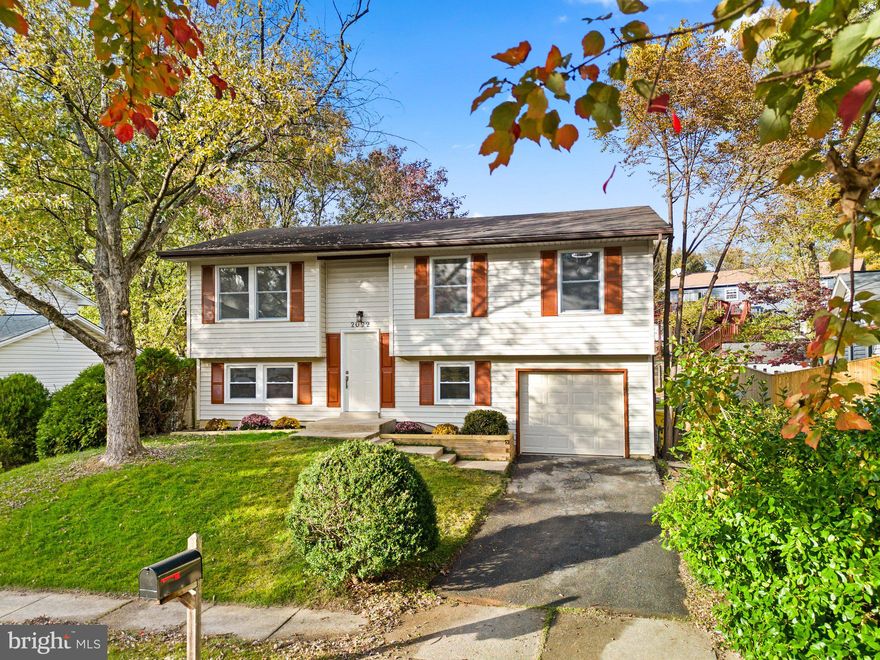 This home has been fully remodeled and updated for modern living including a brand new roof Nov 2023. The first thing you'll notice when you step inside is how bright it is inside with brand new large windows throughout + bright LED lighting. The  main level has been opened up and updated. The kitchen includes beautiful quartz counters and modern new stainless steel appliances.  There is a kitchen island with breakfast bar. The formal dining area is right off the kitchen. The living room is bright and feels open and connected to the kitchen / dining area. The hall way leads to the three spacious bedrooms and an updated hall bath with custom luxury tile. Each bedroom has a bright LED ceiling light fan to make sure that its always bright and ceiling fan has remotes for convenience. The lower level includes a 4th bedroom or can become a home office and a separate spacious family room that opens up to the flat rear yard with deck for entertaining. There is a full bath on the lower level that's beautifully updated. The utility area with laundry and a 1 car attached garage will be accessed through the rear of the lower level. The rear of the home is mostly fenced, flat, private yard. There is off street concrete driveway for 1 car parking. The home sits on a culdesac which is private and quiet. The home is close to plenty of Crofton area shopping including the waugh chapel restaurants and the Wegmans grocery store.