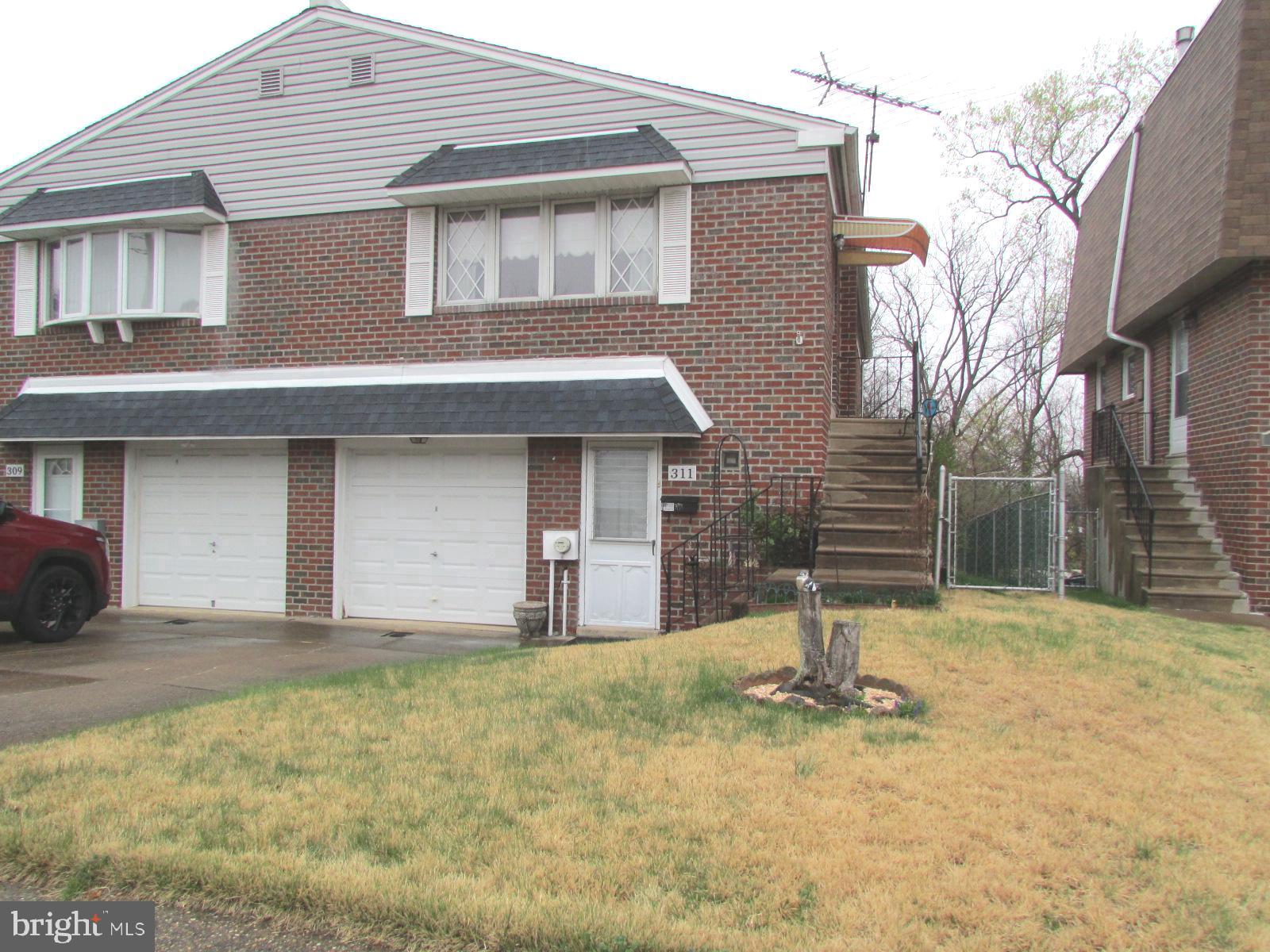Welcome to this Fox Chase twin rancher, steps from the Pennypack Trail! Featuring 3 bedrooms and 2 full baths, this home offers a versatile layout with two bedrooms and a full bath on the main level, plus a fully finished ground level featuring one bedroom, one full bath, and cozy gas fireplace—perfect for a guest suite, home office, or additional living space. Enjoy the convenience of an attached one car garage and a fenced in rear yard, providing a private outdoor retreat. Act quickly, won't last. Location! Location! Location!