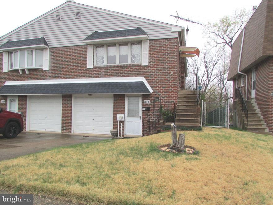 Welcome to this Fox Chase twin rancher, steps from the Pennypack Trail! Featuring 3 bedrooms and 2 full baths, this home offers a versatile layout with two bedrooms and a full bath on the main level, plus a fully finished ground level featuring one bedroom, one full bath, and cozy gas fireplace—perfect for a guest suite, home office, or additional living space. Enjoy the convenience of an attached one car garage and a fenced in rear yard, providing a private outdoor retreat. Act quickly, won't last. Location! Location! Location!