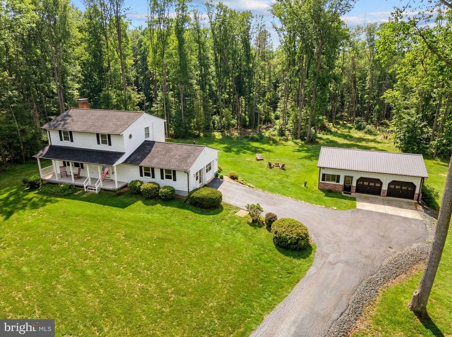 Peaceful Country Living Meets Everyday Convenience *****
Set on 6.81 acres of scenic open and wooded land, this charming three-level Colonial offers the privacy you crave with the accessibility you need. Enjoy room to roam, entertain, or simply unwind in a serene natural setting—while still being just a short drive to Fredericksburg, Manassas, Stafford, and Warrenton via major commuter routes. *****Enjoy breathtaking sunsets from the covered porch just off the kitchen, or soak up the sunshine on the expansive deck that spans the entire length of the home. Surrounded by nature, you’ll appreciate the peaceful setting and abundant wildlife right outside your door. Start your mornings with a cup of coffee accompanied by the gentle chirping of birds. If you’ve been searching for a home that feels like a private retreat, this is the one.*****The heart of the home features a spacious kitchen with a center island and eat-in dining area, complete with a cozy wood-burning fireplace. Sliding doors lead to a covered deck porch with a ceiling fan and large deck —perfect for relaxing while overlooking the expansive backyard. A generous family/rec room just off the kitchen includes a freestanding gas stove, mini-split system, and separate thermostat for added comfort. Also on the main level: a large living room, half bath, and laundry room.*****Upstairs, you’ll find three bedrooms, all equipped with ceiling fans. The two full bathrooms both feature Linen Closets. The spacious primary suite offers a walk-in closet and private ensuite bath. Bedroom #2 features a charming built-in bunk/seating area with a window view and a walk-in closet. Bedroom #3 has a walk-in closet as well!*****The finished lower level offers exceptional additional living space, featuring a spacious family room with built-in shelving, a full bathroom with a shower, a fourth bedroom (not to code), and a versatile den—ideal for a home office. Walk-out access leads to a lower patio and scenic backyard views, creating a seamless indoor-outdoor connection. A wood stove hookup adds warmth and flexibility to the space.*****The detached two-car garage, complete with insulated doors, includes an attached finished bonus room currently used as a gym. Equipped with a window A/C unit, this space is perfect for a home office, studio, or fitness area. The property also offers ample storage for tools and equipment.*****Recent Updates Include: **New roof  **New gutters ** New Downspouts **New Gutter Guards **New Hot Water Heater **Gas Furnace **New kitchen sink **New siding (home wrapped in Tyvek prior to installation) **New metal roof on Detached 2 Car Garage  **All interior faucets and hardware replaced