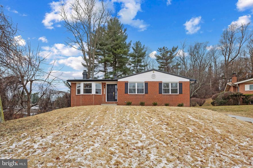 Fully renovated brick-front single-family residence offering 3 bedrooms, 3 bathrooms, and 2,095 finished square feet, ideally located in established Old Court Estates. The freshly painted interior showcases extensive updates, including updated flooring, renovated bathrooms, replacement windows, and updated lighting with new receptacles and light switches. Major improvements include a roof, air-conditioning unit, and water heater recently installed in 2025.

On the main level, luxury vinyl plank flooring flows throughout the combined living and dining rooms, creating a bright, open-concept layout. The living room is enhanced by a fireplace, while the dining area is accented by a chandelier. Both spaces feature curved bay windows that fill the area with abundant natural light. The remodeled eat-in kitchen is thoughtfully designed with newly installed stainless steel appliances, crisp white cabinetry, a skylight, a built-in pantry, a breakfast bar, and a cozy breakfast nook. Just beyond the kitchen, a step-down family room offers sliding glass doors with exterior access, perfect for indoor-outdoor living. The residence also offers three carpeted bedrooms and two full bathrooms, highlighted by the primary suite with a private ensuite bath and a spacious closet. The lower level expands the living space with a large recreation room and a full bathroom, ideal for entertaining or relaxing. Two versatile bonus rooms offer flexibility for a guest bedroom, playroom, home gym, or home office, along with a combined laundry and storage room. Outdoor living is enhanced by a large tiered deck recently installed in 2025 overlooking the backyard that backs to trees, providing a private and peaceful setting.