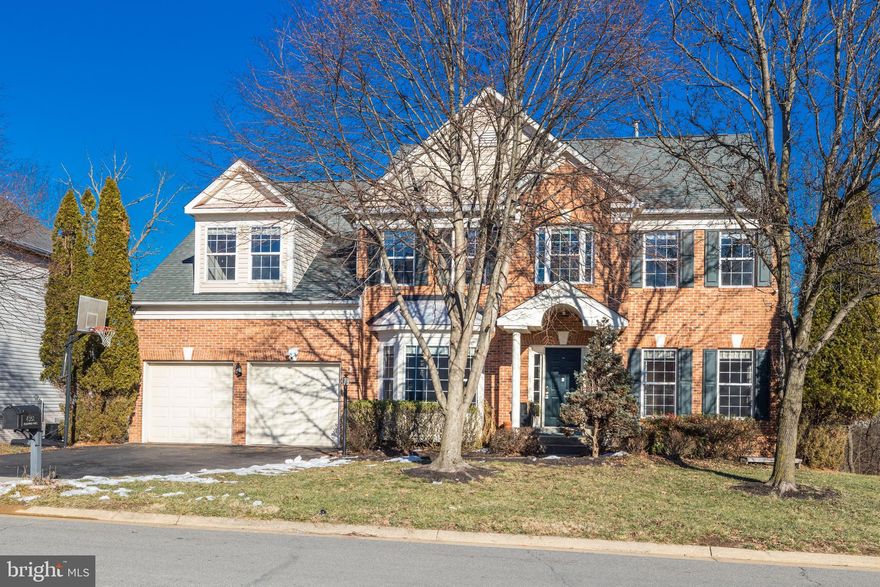 This beautiful home backs to mature trees.  Impressive floor to ceiling stone fireplace. Open floor plan on main level. Gourmet kitchen with stainless steel appliances and granite counters. Light filled sun room with 3 skylights. 5 generous bedrooms upstairs with 3 full bathrooms. Luxurious owner's retreat with cozy fireplace & deluxe bath. Basement features recreation room, large bar, fireplace, media area, and bamboo floors. Deck and patio are extremely private.