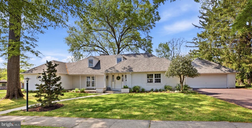 Experience classic Montgomery County charm with modern sophistication at 327 N Roland Street, an expanded ranch tucked within the desirable Rosedale section of Pottstown. The home offers a generous layout with four bedrooms and four-and-a-half bathrooms, giving buyers plenty of room to spread out while enjoying the ease and comfort of a thoughtfully designed floor plan. Set in an established residential neighborhood, this home blends character, comfort, and thoughtful updates, creating a warm and inviting setting for everyday living and entertaining.
The main level welcomes you with a bright and stylish living room designed for both relaxation and gathering. Rich hardwood floors, recessed lighting, and a soft neutral palette create an airy, polished feel, while the fireplace with a classic mantel serves as the room’s natural focal point. Custom built-in shelving adds charm and function, offering space for décor, books, or personal touches. The open flow from the living area toward the kitchen gives the home an easy sense of connection, making it ideal for hosting or everyday family living.
The heart of the home is a beautifully remodeled kitchen designed with both style and function in mind. Bright white cabinetry, sleek hardware, recessed lighting, and elegant pendant fixtures create a clean, timeless feel, while the oversized center island with quartz countertops offers abundant prep space, storage, and casual seating. The kitchen opens beautifully to the dining area and nearby living spaces, allowing natural movement between cooking, entertaining, and relaxing. Stainless-steel appliances, glass-front accent cabinetry, a built-in microwave, and a dedicated beverage or coffee station add both convenience and charm. Natural light and rich hardwood floors carry throughout the main level, creating a warm, open, and cohesive atmosphere.
Just beyond the main living spaces, the sunroom offers a peaceful retreat surrounded by natural light. Framed by expansive wood-trimmed sliding glass doors and bright white brick walls, this inviting space is perfect for morning coffee, reading, working from home, or simply enjoying views of the backyard. With direct access to the brick patio and outdoor seating area, the sunroom creates a seamless indoor-outdoor connection and adds a rare level of charm and versatility to the home.
The property carries the character of an established home while offering the space and flexibility today’s buyers desire. A two-car garage adds valuable convenience for parking, storage, hobbies, or workshop use.
Located in the Rosedale neighborhood of Pottstown, this home places you close to local schools, parks, shopping, dining, and major commuter routes throughout Montgomery County. With its impressive remodeled kitchen, inviting living room, spacious interior, light-filled sunroom and established neighborhood setting, 327 N Roland Street is a wonderful opportunity for anyone seeking comfort, convenience, and timeless appeal.