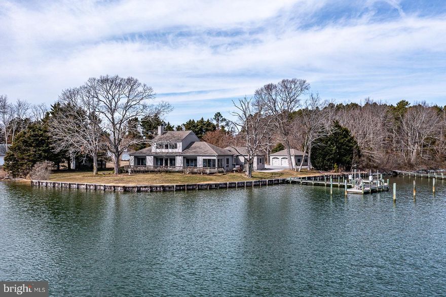 "Tuckaway" is a hidden gem with 300+ feet of waterfront and 6'+MLW on the peaceful waters of Arthur Cove off Indian Creek and the Chesapeake Bay. Sumptuous professional landscaping with irrigation system Architecturally designed builder's home of exceptional quality. Wide water views from nearly every window provides a sense of tranquility and peace. Custom built-in bookcases surround the circa 1775 hand hewn mantle once belonging to Col. William Cabell of "Union Hill." Kitchen with granite counters, and large SubZero wine cooler. The pier, a mere 43 feet from the rear foyer with no steps. Easy ramp access into rear foyer. Fish, crab, enjoy watersports, beautiful sunrises and sunsets, and lots of water fowl. Pier/Dock totally replaced in 2015 with 3 slips, boat lift and a deluxe fish cleaning station. Two year old ‘Generac’ generator. Oversized, finished, heated, detached 2-car garage w/ many extras and a separate garden shed. Previous street address 361 Tuckahoe may be used for GPS. Shown by appt. A very special place minutes from town and a golf cart ride to Indian Creek Yacht & Country Club. Tantalizing, waiting for you.