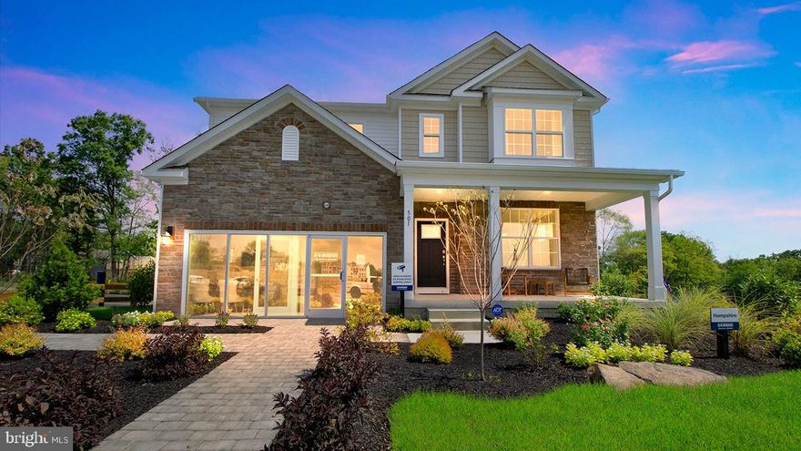 The Hampshire model by DR Horton is the perfect blend of tradition and innovation, incorporating a bright and open floor plan but with comfortable spaces for all to enjoy, either together or independently of one another.  The main living area is large enough to entertain a crowd, with a well-appointed kitchen and large center island that anchors the space, overlooking the family room and an informal dining area, complemented by a cozy and convenient gas fireplace.  The large windows and sliding glass doors bring in plenty of natural light. A separate, formal dining room off of the kitchen, past the convenient butler’s pantry and walk-in pantry, offers a more intimate and traditional space for a dinner gathering.  One of the more innovative features of this model is the offering of a fifth bedroom and separate full bathroom on the main entry level.  This room can be used in a multitude of ways—a spacious guest room, a private office space, or a playroom for younger children that can contain the clutter of toys behind a closed door when company arrives. The full bathroom next to that fifth bedroom solidifies this model’s flexibility and function.  The second floor continues to impress with a primary suite complete with sitting room, a bathroom that offers a large stand up shower with bench, two separate sinks, two linen closets and a private toilet area.  The very generous walk-in closet is laid out thoughtfully with two wings, and leads into a laundry room easily large enough for a five-bedroom dwelling.  The secondary bedrooms are all well sized, and one of the best features of this second floor are the wide and open hallways.  The basement is the full footprint of this model, and includes rough-in plumbing for another full bathroom to add later.  The Hampshire also offers a deep, oversized front porch that runs the length of the entry hall and dining area, and a front entry, oversized two car garage.  Overall, the feat that the Hampshire model achieves is its ability to be spacious yet cozy, where a family of two would not be overwhelmed by it’s size, and a family of seven would not want for space or storage.  Model home hours will be Mon-Saturday 10:00 am to 5:00 pm and Sundays 11:00 am to 5:00 pm. Photos are representative and not the actual home. The finish colors in this home may be different than pictured.