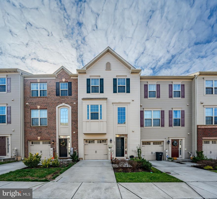 Custom-built in 2017, this spacious 3-story townhome offers 3 bedrooms and 2.5 bathrooms and  is seeking its second owner! Abundant natural light illuminates every floor as you pass through the front entrance or attached 1-car garage, suitable even for a compact pick-up truck. The entry level offers plenty of storage space and a generously sized recreation room with endless possibilities. There is also a plumbed rough-in to easily install a second half bathroom, and a walk-out to the fenced backyard. Venture to the second level where you will find a large open concept living space boasting beautiful oak hardwood floors, a chef’s kitchen complete with custom cabinets, granite countertops, stainless steel appliances, and center-island and a dining area perfect for hosting, along with a powder room easily accessible to guests. Step outside to the kitchen deck which provides an ideal spot for grilling and entertaining. On the upper level you will find 3 bedrooms and 2 full bathrooms, including a primary suite featuring 2 closets and cozy en-suite bathroom. Don’t let this one get away!