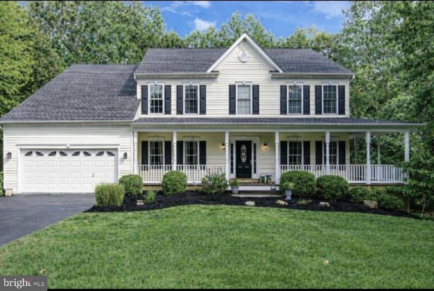 Welcome to this captivating home in the highly sought-after Deer Valley neighborhood of Manassas. Enjoy the perfect balance of convenience and privacy, situated on a one-acre lot tucked away in a quiet cul-de-sac. This beautifully updated home is located in the award-winning Colgan High School district, offers no HOA, and has been thoughtfully renovated for modern living.
Step inside to a sweeping staircase that immediately sets an elegant tone. Gleaming hardwood floors guide you through the open floor plan and into the luxurious two-story family room, where you can lounge the day away beside the cozy gas fireplace, framed by impressive wall-to-wall windows that flood the space with natural light. The upper level features a stunning catwalk overlooking the main living space, creating architectural interest while thoughtfully dividing the bedroom areas.
Adjacent to the family room is the gourmet kitchen—an entertainer’s dream—featuring professional-grade appliances, stunning granite countertops, stylish white cabinetry, and a massive center island prep area fit for the finest chef. Recent upgrades include a new dishwasher and microwave (2024).
Designed with entertaining in mind, this home shines both indoors and out. Impress your guests on the charming wraparound porch or host unforgettable gatherings on the expansive deck with a screened-in porch. The meticulously maintained backyard is surrounded by mature trees and enhanced by a five-zone outdoor irrigation system, offering exceptional privacy and ease of care.
Looking for additional indoor entertainment space? The spacious lower level boasts a grand recreation room complete with a wet bar, complemented by new carpet installed in 2020, making it perfect for movie nights, game days, or hosting guests.
Upstairs, your private retreat awaits in the primary suite, featuring a generous walk-in closet and a spa-like bathroom with a soaking tub and separate shower. The upper level also offers a Jack-and-Jill bathroom shared between Bedrooms One and Two, while Bedroom Three enjoys its own private en-suite bath, providing comfort and privacy for family and guests alike.
Notable recent improvements include a new roof (2020), upper-level condenser and exterior unit replaced in 2020, new water heater and sump pump (2024), garage door opener (2020), and living room carpet installed in 2020, Fresh paint throughout the home, New carpet in ML office, all carpets have been professionally cleaned, The entire home/deck has been recently power washed, front porch freshly painted. The garage is finished with an exceptional epoxy-coated floor, and new black gutters and downspouts were installed in 2023, adding both style and durability.  There are also 2 laundry areas, one on the ML and the second on the LL.
This home truly offers everything you’ve been searching for—and more.