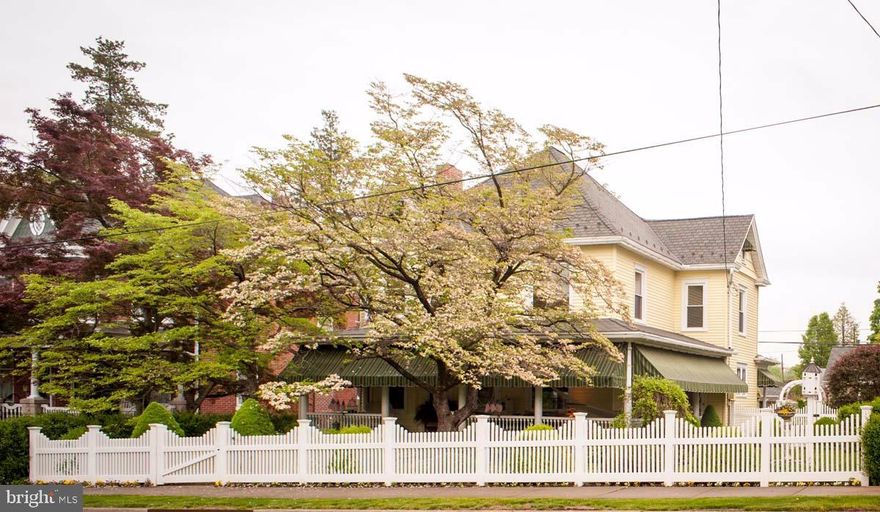 Lovingly restored from top to bottom this 1916 Victorian beauty features original woodwork, new roof and updated mechanicals.  Meticulously maintained, this home includes a renovated kitchen that incorporates original cabinetry and vintage soap stone surrounding the sink.  Outdoor paradise awaits you on the home's large wrap around porch and surrounding lush gardens.  Flagstone patio, meandering paths, gazebo and two car garage with additional off street parking.  This premium restoration in charming Lititz is a must see.  (See list of Improvements done by Sellers)