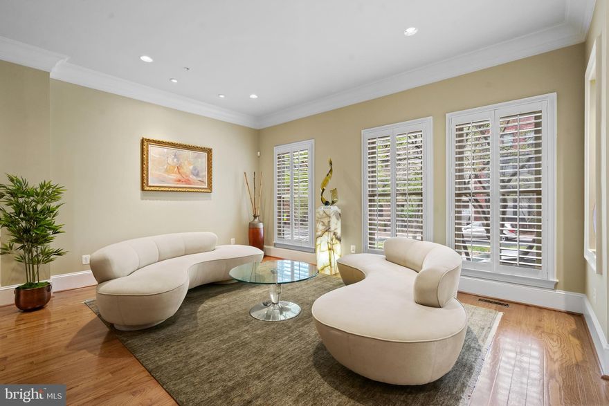 A rare opportunity to own a prestigious "Lincoln" model Brownstone in Park Potomac one of only 12 in the entire subdivision. This spacious, ELEVATOR-ready residence greets you with an airy main level featuring rich hardwood flooring, custom crown molding, and a seamless flow from the ceremonial dining room to the grand living area. The heart of the home is a chef's kitchen equipped with a six-burner Viking stove, KitchenAid appliances, and a light-filled family room with a gas fireplace leading to a private balcony. The second level serves as a sanctuary, featuring a massive owner's suite with dual walk-in closets and a spa-like natural marble bathroom complete with a steam shower, soaking tub, and towel warmer. Two additional bedrooms and a full laundry room complete this floor. The fourth-level loft boasts a fourth bedroom, an office, a full bathroom and huge entertainment zone, that opens to an expansive roof terrace with stunning treetop views. The lower level offers versatility with a home gym, media room, and a two-car garage featuring both wheelchair lift and elevator access. Enjoy luxury amenities at your doorstep, including a pool, clubhouse, Harris Teeter, and fine dining, all with easy access to I-270 and I-495. Prestige and comfort in one place!