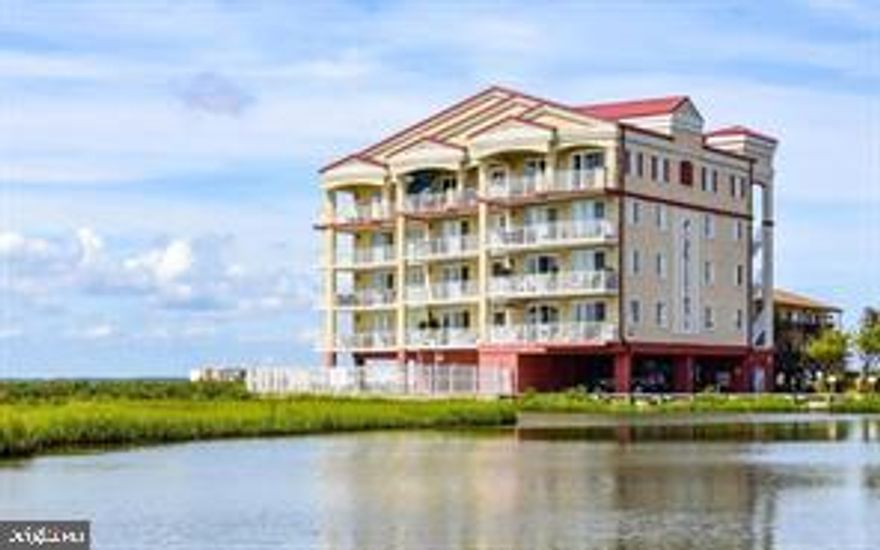 Welcome to your perfect year-round waterfront retreat in the heart of Ocean City. This beautifully furnished three-bedroom, two-bathroom condominium offers breathtaking direct bay views and is just a short stroll from the beach.

Step into a bright, airy living space featuring soaring 9-foot ceilings and abundant natural light. The open-concept design seamlessly connects the living room, complete with a cozy fireplace, to a gourmet kitchen boasting extensive counter space, dual ovens, and a modern induction range.

The primary bedroom is a serene sanctuary with a king-sized bed and walk-in closet. The en-suite bathroom is a spa-like oasis featuring a spacious shower, luxurious jacuzzi tub, and double vanity sink. Two additional bedrooms provide comfortable accommodations for family or guests.

A generous balcony offers the perfect spot to enjoy morning coffee or evening sunsets over the bay. The building's amenities include a refreshing community pool, convenient laundry facilities with washer and dryer, and additional storage space. Outdoor enthusiasts will appreciate the community grill deck overlooking a private pond and dedicated kayak storage.

Practical conveniences include covered parking, elevator access, and a secure lobby entrance. The prime location puts you within easy reach of Ocean City's finest restaurants and shopping destinations. Building maintenance is worry-free with condominium fees covered by the landlord.

Experience coastal living at its finest in this thoughtfully appointed residence where comfort meets convenience in one of Ocean City's most desirable neighborhoods.