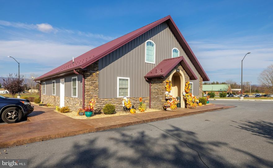 This commercial property features a 2,400 sq. ft. office building built in 2019, a 7,500 sq. ft. mini storage facility, and a spacious RV/boat lot, all situated on 8.651 acres along high-visibility Route 33 Spotswood Trail. The office building is in excellent condition and thoughtfully designed with five private offices, a conference room, a break room/kitchen, a receptionist area, a copy room, one bathroom, and a welcoming waiting area. The layout is perfect for a range of professional services to include office or medical. The Mini Storage facility offers 50 units which vary in size and a fully fenced gravel RV/boat lot which offers 73 spaces, all of which stay leased year around. Security is a priority, with pole lights and partial fencing throughout the property ensuring safety and convenience for tenants. With surplus land available, this property is perfect for expansion, offering ample room for additional mini storage units to meet growing demand. The prime location benefits from high traffic counts, making it a sought-after destination for both storage users and investors. Don’t miss this versatile, income-generating property with endless potential.