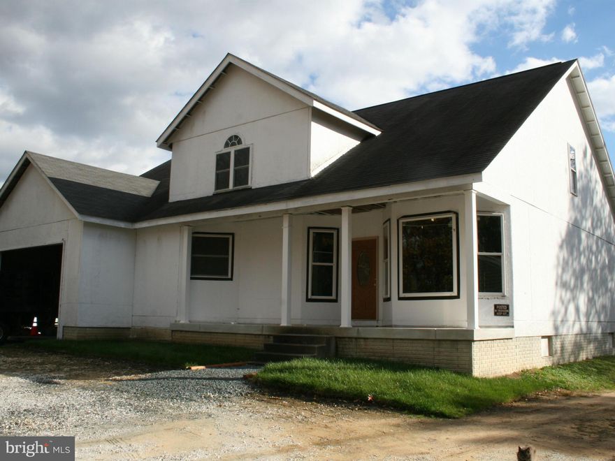 Very Large 2 story home, approx 6,000 sq ft (SHELL). Roof and windows are in,  inside of home is framed out  as a 4 bedroom , 4 bathroom home with a Large family room including a stone fireplace. Property being sold as is. See disclosures/ disclaimers in MRIS.   Building permit, survey etc.