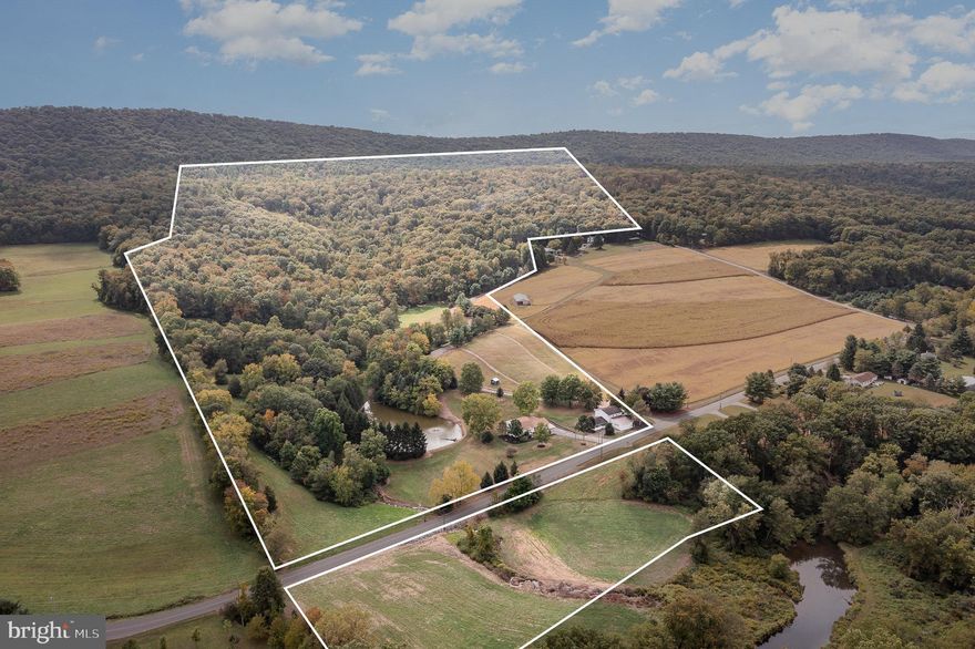 Discover your private oasis on over 55 acres of picturesque land, perfect for a gentleman's farm. This property features a mix of tillable fields, mature timber in the wooded areas, and stunning natural beauty. The charming 3-bedroom, 2-bathroom home is equipped with newer windows and doors, a new roof, and central A/C for year-round comfort.
The impressive bank barn includes three horse stalls and a lower-level heated workshop with an air compressor and running water, while the upper level offers ample storage for equipment. Enjoy the serene landscape with a large pond, home to bass, trout, and koi, as well as a delightful waterfall nestled in the mountain terrain.
Take advantage of additional tillable land—an extra 30 acres available for consideration. With electric fencing around the pasture, water taps in the fields, and borders along Powell's Creek, a stocked fishing stream, this property is an outdoor enthusiast's dream.
Stay cozy year-round with a heat pump, rice coal supplemental heat system, and a propane-fired log set. The mature timber adds both aesthetic value and potential resources. Plus, mineral rights convey with the property, enhancing its appeal.
Xfinity internet is available, ensuring you stay connected while enjoying the tranquility of rural living. This exceptional estate is located near over a million acres of State Game Lands, offering endless opportunities for recreation and exploration.
Don’t miss the chance to own this unique property that combines rural charm with the ideal setting for a gentleman's farm!