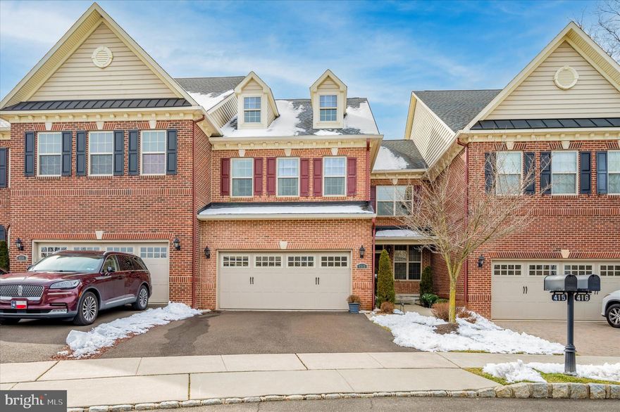 Beautiful and spacious townhouse in a lovely development! This open concept home boasts high ceilings, lots of windows allowing for tons of natural light, gas fireplace, powder room and hardwood floors throughout the first floor! Kitchen offers granite countertops, stainless steel appliances and breakfast bar. Lot's of space for cooking, dining and entertaining! Second floor includes 3 large bedrooms, 2 full bathrooms, surprisingly sizable laundry room as well as ample closet space! The finished basement is a gem with a full bathroom, extensive storage space and limitless options! Back deck is perfect for summertime BBQ's and includes a newly installed retractable awning so outdoor fun can continue in various weather conditions! Two car garage as well as driveway parking and street parking. This development is walking distance from the Flower Mills shopping center for endless convenience! Restaurants, gym, groceries are all just seconds away. Close to major highways! Don't miss out on this opportunity -- schedule a tour!