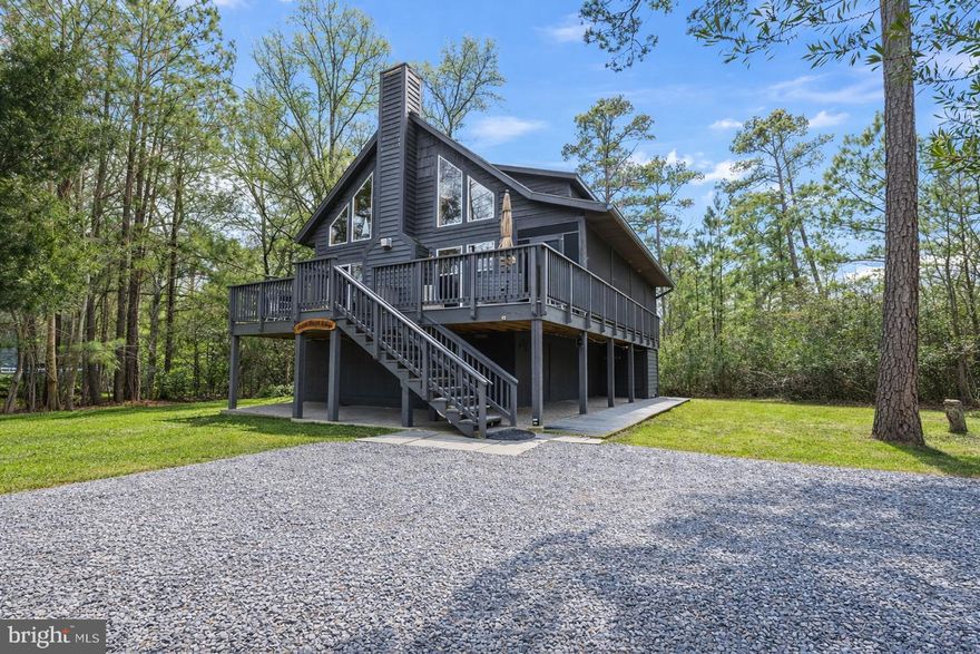 Turn-Key Coastal Retreat with Water Access in Coveted Cove Point Beach

Discover Cedar Beach Lodge—a rare opportunity to own a turn-key retreat in an exclusive beachfront community along the Chesapeake Bay. This stunning 3BR/2BA home is a proven, income-producing vacation rental with a loyal base of repeat guests, or it can serve as your own private coastal getaway.
Just steps from a private sandy beach, the fully furnished home offers effortless comfort and an inviting open-concept design. The great room features soaring ceilings and seamless flow between the family room, dining area, and fully equipped kitchen—ideal for gathering with family and friends. Step onto the spacious deck or relax in the screened-in porch to enjoy morning coffee, evening sunsets, and the soothing rhythm of the waves.
The outdoor amenities elevate the coastal lifestyle even further: enjoy a firepit under the stars, rinse off in the outdoor shower after a beach day, and take advantage of ample parking for guests. A secure walk-in storage area beneath the home provides room for bikes, paddleboards, and all your beach essentials.
From sunrise walks to bonfires at dusk, every day here feels like a vacation. Stroll to the historic Cove Point Lighthouse or hunt for Miocene-era fossils and shark’s teeth along the one-mile private shoreline.
Located just one hour from Annapolis and Washington, D.C., and only minutes from Solomons Island, Cedar Beach Lodge offers the perfect balance of tranquility and convenience. Whether you’re seeking a lifestyle, an investment, or both—this is your chance to own a piece of Chesapeake Bay paradise.