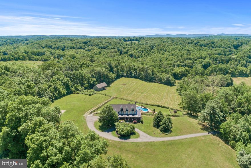 Sweeping pastoral views from this hidden gem located just a few miles south of Purcellville, comprising 29.53 acres. 5 bedroom, 5.5 bathroom home with fully renovated and self-contained lower level apartment offering additional living space. Wrap around high quality porch with stunning views of the private, surrounding landscape. Equine amenities include 4 stall barn, pastures, access to Beaver Dam Creek and several site options for an outdoor arena. Beautiful heated pool with hard landscape and hot tub. Newly painted stucco exterior with new roofing. The property comprises 2 separate tax id parcels, 563265831000 (15.23 acres) and 563163567000 (14.3 acres) with potential to build a second home, sell the adjoining parcel and/or consider a conservation easement. The location also offers additional scope for equine, winery or hospitality use and has in the recent past operated as a successful Airbnb destination. Viewing highly recommended to appreciate the serene ambience, all within reach of the DC metro commute and without the need to access any gravel roads! All appointments must be scheduled with the listing agent.