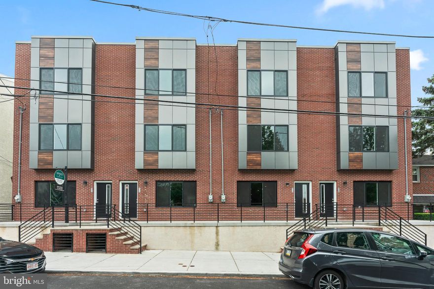 A stunning new development in the heart of Manayunk, Philadelphia. These contemporary homes are designed to impress, featuring expansive layouts and sophisticated finishes that elevate the typical city home experience.

Upon entry, be greeted by soaring ceilings and a spacious, open-concept design that seamlessly connects the living room, dining area, and kitchen—perfect for entertaining. The modern kitchen is a chef's dream, complete with sleek white cabinetry and top-of-the-line stainless steel appliances. A convenient powder room on the main level adds to the ease of hosting guests.

Step outside to your private, generously sized yard, ideal for alfresco dining and relaxation. The finished basement offers versatile space to suit your lifestyle needs, whether it's additional living quarters, a home gym, or a secluded office.

The second floor is designed with comfort and convenience in mind. It features a guest suite with a private bath, additional bedrooms, and a well-appointed laundry room. The third floor is the pinnacle of luxury, boasting a primary suite with two walk-in closets leading to a spa-like bathroom with a glass shower, soaking tub, and dual vanity sinks. Another en-suite bedroom on this level ensures ample space and privacy for everyone.

The crowning jewel of these homes is the rooftop deck, offering breathtaking views of the Schuylkill River Valley and the Center City skyline. This stunning outdoor space is perfect for relaxation and entertaining, providing a picturesque backdrop to your new home.

With a 100% 10-year tax abatement, this home is not only unparalleled luxury but also a significant financial advantage. Experience the best of Manayunk living in these exquisite new constructions—your dream home awaits.