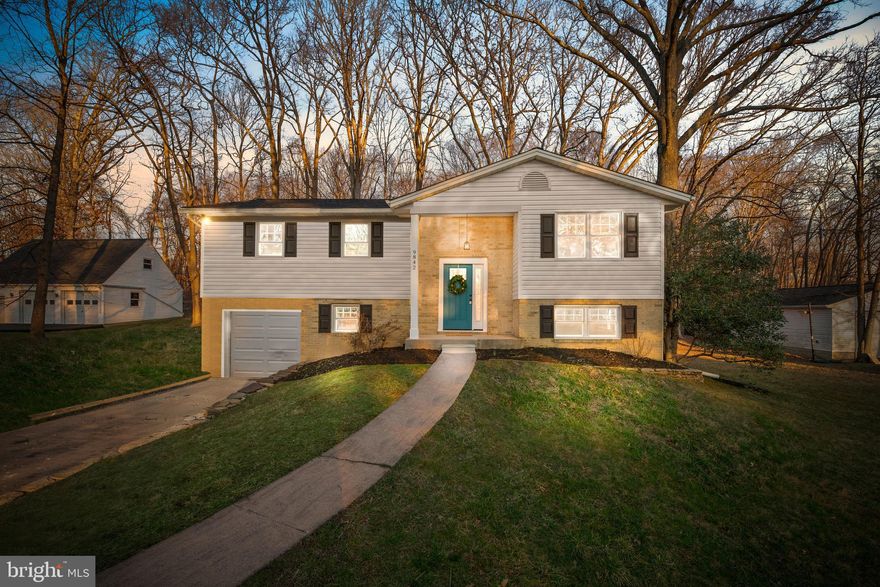 The wait is finally over!  STUNNING RENOVATIONS on this beautiful home in Ellicott City!  A wide-open floorplan creates tons of room to spread out! Covered front porch! New front door!  Light and bright!  Refinished hardwood floors!  New custom hardwood stairs and wrought iron railings! New custom lighting throughout! Fresh paint! New carpet! Updated windows! Beautiful kitchen with custom white cabinets, beautiful granite counters, stainless steel appliances including a 5 burner gas stove, farm sink and custom tile backsplash too! Renovated bathrooms! Spacious master suite with a brand new bathroom! Fully finished lower level with a spacious family room with wood-burning fireplace, bedroom and tons of storage!  1 car garage with a new garage door and tons of room for additional cars on the long private driveway!  HUGE new deck with steps to the .59 acre yard that backs to trees!  There's even a shed in the yard for storage too! No HOA!  Roof '19!