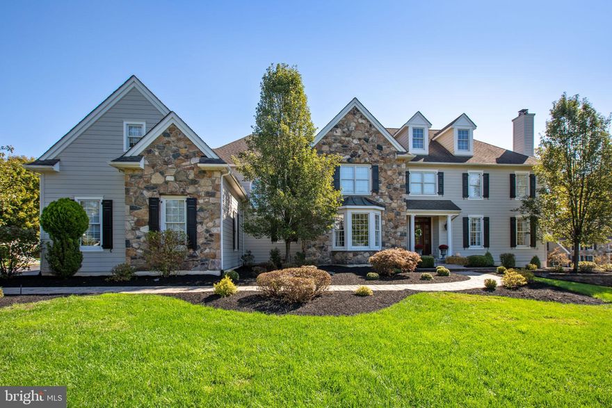 OFFER DEADLINE MONDAY, MARCH 18th NOON. Welcome to 120 Spring Tree Lane, boasting nearly $250,000 in improvements, this sprawling, amenity-rich colonial is perched on a premium, oversize lot in sought-after Springton Reserve. From the side driveway, a stone path winds through the professionally landscaped front yard to a columned front porch. Natural light streams in from the glass-paneled front door, highlighting the gleaming hardwood floors, custom millwork, nine-foot ceilings, neutral paint and beautiful main staircase. From the large foyer, an arched opening frames a light-filled living room with crown molding and gas fireplace. Opposite the living room sits a sunny dining room with tray ceiling, custom millwork and beautiful bay window with lovely front yard views. A charming barn door slides open to reveal a renovated, farmhouse-style eat-in kitchen with high-end appliances—including a Wolf® range and custom hood—center island with sink and microwave drawer, shiplap walls and stunning, oversize above-sink window capturing the scenic backyard vistas. The kitchen opens to a breakfast area and a family room just beyond with a gas fireplace, stone accent wall, vaulted ceilings and abundant windows. The renovated brick-floor mudroom  connects to the three-car garage, a powder room and secondary (rear) staircase. On the other side of the main level, a rear wing houses an updated multi-room suite. This suite includes a full bath with oversize walk-in shower, kitchenette, laundry room with custom cabinetry and two generously sized bedrooms, one of which could function as a sitting room, gym or home office if desired.  This space completes the expansive first floor. More updates and amenities await upstairs, where you’ll find a bright and airy primary suite with tray ceiling, walk-in closets and renovated ensuite full bath with soaking tub, custom glass shower and a custom vanity. The second floor also includes a four well-sized secondary bedrooms—two with ensuite full baths (one brand new!) and two connected via jack-and-jill bath as well as a large laundry room. Back downstairs, the walk-out lower level includes multiple areas for entertaining and play, plus a bar area with beverage fridge, full bath and large sitting room separated by French doors. The lush and private backyard is a resort-like oasis filled with every amenity imaginable, including a heated saltwater pool and spa, stone waterfall, fire pit, new tiered slate patio,  and professional lighting. Located on a sidewalk-lined loop mere minutes from the shops, restaurants and attractions of Ellis Preserve and West Chester Pike. The list of amenities and upgrades go on and include a whole house generator, remediated original stucco with Hardieboard and much more.  A wonderful opportunity to be in Newtown Square! This delightful home is ready for you to tour and treasure.