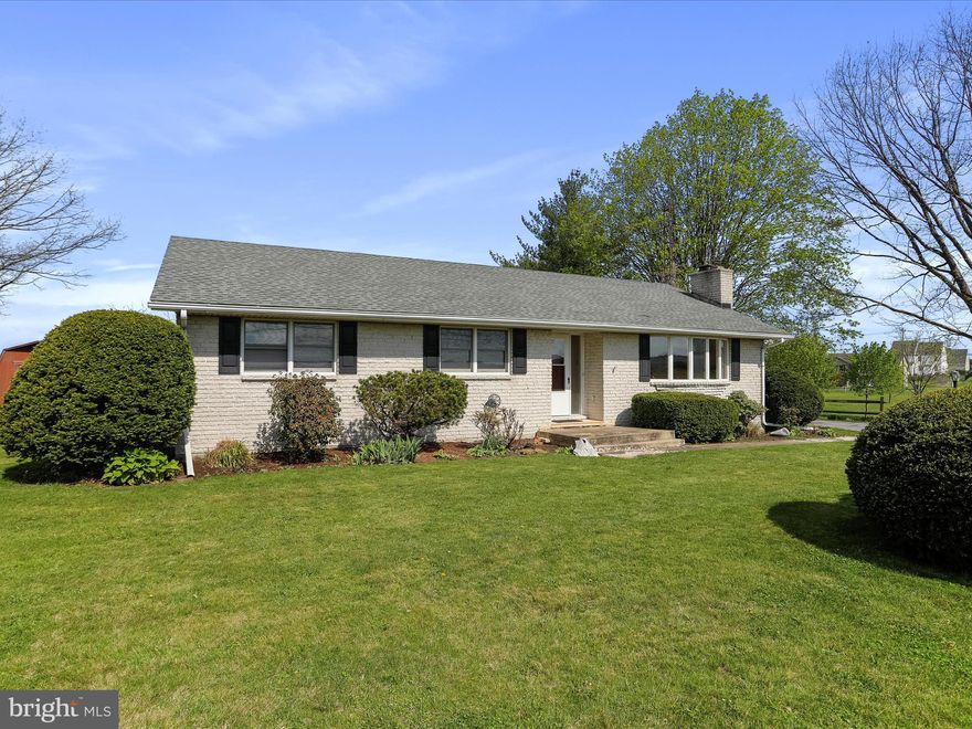 Welcome to this charming all-brick rancher, set on a spacious 0.93-acre lot—perfect for outdoor entertaining or simply relaxing while taking in the peaceful views.  An attached carport offers convenient, covered parking.
Step inside to a bright and inviting living room, featuring a fireplace (currently set up for an insert) and a large bow window that floods the space with natural light.
The spacious kitchen includes plenty of cabinet storage and a cozy dining area, ideal for everyday meals or hosting family and friends.
This home offers a comfortable layout with a primary bedroom that includes a private bath with a stand-up shower, two additional bedrooms, and a full hall bathroom. The laundry area is conveniently located on the main level.
The basement is over 75% finished, providing additional living space that could serve as a family room, entertainment area, or even an extra bedroom. The unfinished portion is perfect for a workshop, storage, or future customization.
Recent updates include a newer roof and A/C system. With so much to offer, this move-in-ready home is just waiting for your personal touch!   The front walk way is scheduled to be replaced.
Located near Antrim Township Community Park and Whitetail Ski and Golf Resort.  Easy access to Interstate 81 and Route 11.