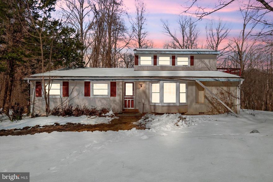 AS-IS | CASH OFFERS ONLY | 5 ACRES. 
Incredible investor opportunity situated on 5 acres. This 4-bedroom, 2.5-bath property offers strong upside for experienced investors seeking a full renovation project. The existing footprint and layout provide a solid foundation for a complete rehab. The property features three decks and an oversized garage structure, offering additional value-add potential. Sold strictly AS-IS. Seller will make no repairs, credits, or warranties. Ideal for flippers seeking acreage-driven resale value, full renovation potential, privacy, and land appeal. Investors only. Cash offers only.