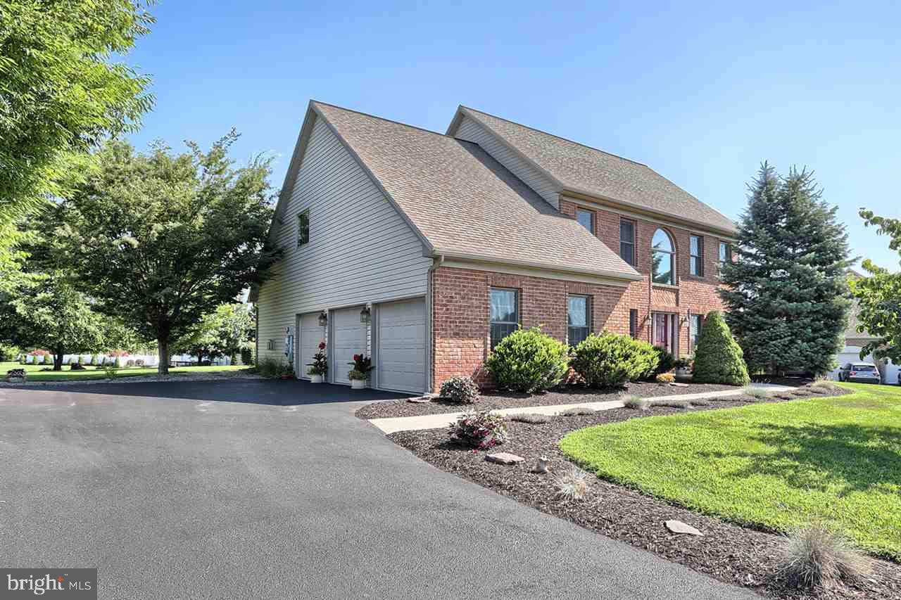 Come home to this beautiful and well maintained custom built Traditional by Master Builder Fred Tiday! From the 2 story foyer to the cherry kitchen with center island to the family room with cathedral ceiling, everything about this house shows quality and detail! Lots of tile/wood.You will be amazed by the huge walk-in closet in the master and the nicely appointed master bath! The lower level is perfect for finishing. This home boasts an over-sized 3 car side entry garage and a very nicely landscaped yard.