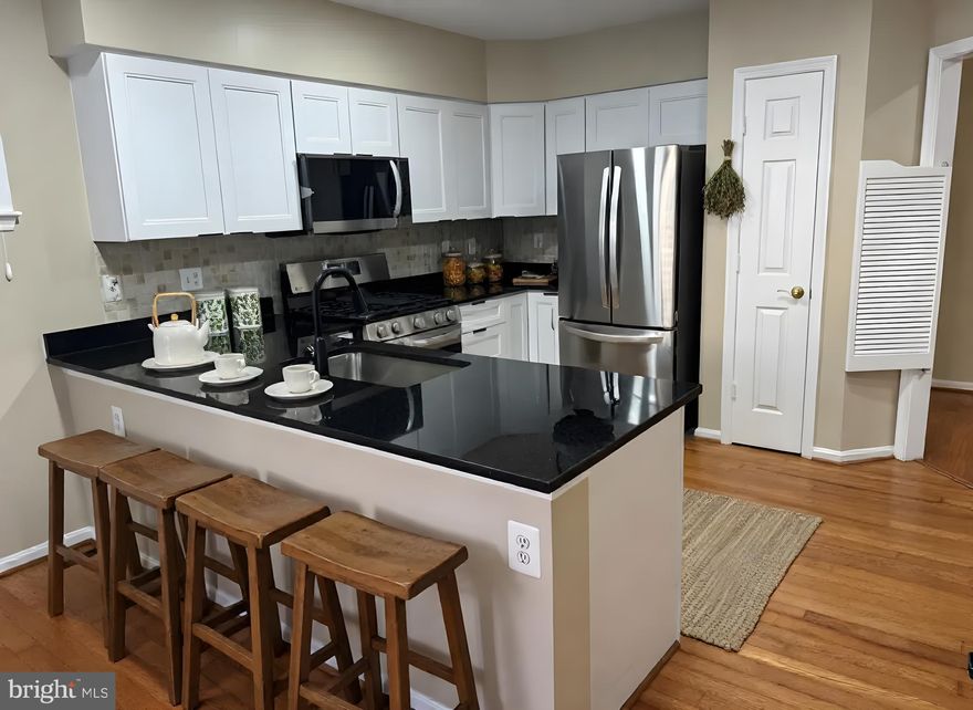 Convenient Mays Chapel North Elevator building in the Tullamore Community, directly across the street from the Roundwood Shopping Center. This unit shows well as you open the front door, and your eye catches the beautiful hardwood flooring throughout. The spacious feel just flows from the living room to include the dining room and the bonus eating area in the newly renovated kitchen.
Freshly painted throughout
Just installed All new kitchen cabinets
Just installed new granite countertops
All new kitchen appliances - never used!
Many new light fixtures too!
Always nice to have- the gas fireplace!
FYI-Through the end of 2027, the monthly condo fee includes an $87.00 increase for replacement of elevators.
Don't delay, see this one today.