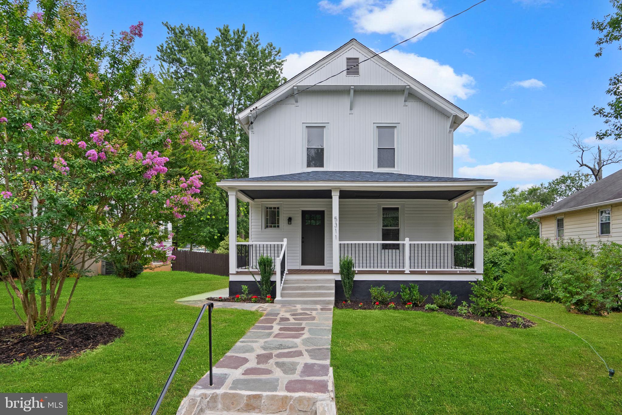 PRICE REPOSITIONED! NEW, NEW, NEW! Most updated house in Historic Hyattsville with oversized 2 CAR GARAGE + ADD’L PARKING! Move-in ready reimagined 1904 farmhouse style home. ALL-NEW— drywall and insulation, plumbing, wiring and lighting, windows. Designer paint colors, luxury maple-colored vinyl plank flooring throughout the main living areas. BRAND NEW Kitchen features new maple cabinetry, open floating shelves, contrasting almond maple island, pendant lighting, quartz counters, a white farmhouse sink. Stainless steel appliances. Open layout. Mudroom with charcoal herringbone-patterned porcelain mosaic tile and brand-new washer and dryer. Powder room with weathered tan vanity/stone countertop. 9’ CEILINGS on main level. Foyer with home’s original stained glass window, restored staircase balusters and railing. Primary suite is a private retreat with accent wall, chandelier, modern lighting, and an absolute oversized walk-in closet. Luxurious en suite bathroom boasts gold marble matte porcelain tile, dual 48-inch greige vanities with marble tops and gold faucets, 54-inch freestanding soaking tub with a coordinating gold handheld faucet, and a stunning shower finished with gold marble tiled walls, penny tile floors, marble thresholds, a frameless glass door, and matte black fixtures. Two additional bedrooms with and ample closet space share a beautifully appointed hall bathroom with hexagon porcelain tile flooring, freestanding vanity with stone top, artisan frost ceramic tile shower walls, and black plumbing fixtures. The attic has been fully insulated— POTENTIAL FOR FINISHED SPACE. Two-panel interior doors and fiberglass exterior doors with new hardware throughout. Lower level updated with new forced-air HVAC system, gas furnace, hot water heater, sump pump, new staircase, fresh paint, and full insulation/vapor barrier. Front porch framing and footings have been rebuilt. POTENTIAL FOR SMALL BSMT ROOM. Check out the curb appeal: granite wall, beautifully restored flagstone sidewalk, new landscaping, new lawn. Front porch with new decking and low-maintenance vinyl railings. Huge flat backyard offers a new patio and sidewalks. **PARKING GALORE*** Oversized detached two-car garage with new fiberglass door, new garage door, fresh paint, siding, and brand-new windows. Parallel parking space, plus potential parking pad for a dedicated third or fourth space. All NEW SIDING with board-and-batten above the porch. NEWER ROOF is three years young. Historic district of Hyattsville. Steps to Kings Park children’s playground. Short walk to the David Driskell Community Park and Ancostia Trails. Minutes to DC. Quick settlement available. Photos feature virtual staging.