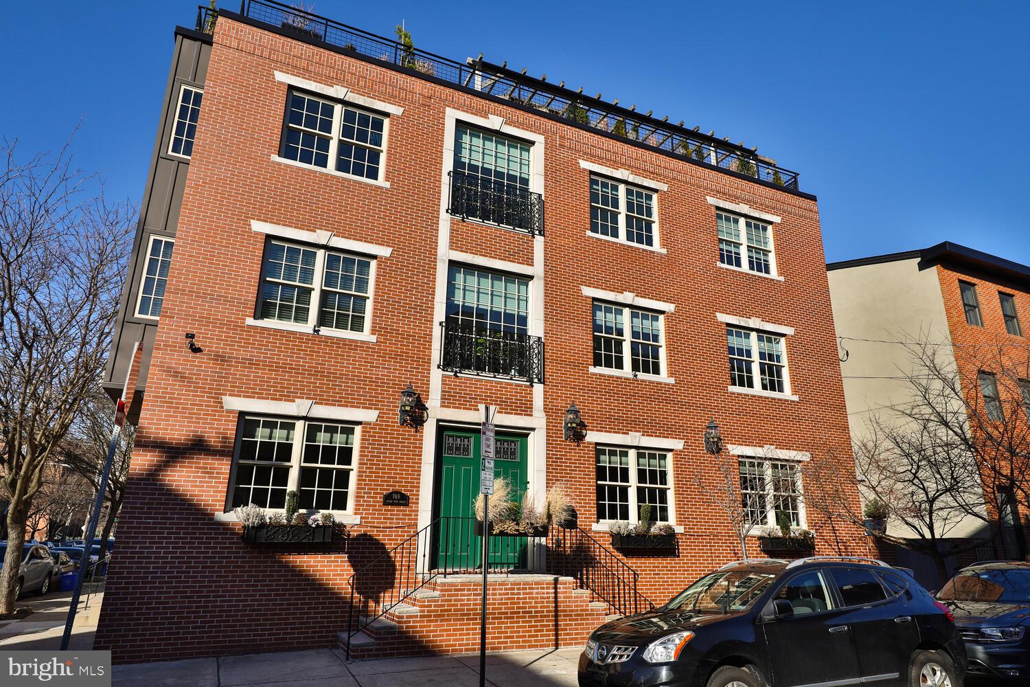 Enjoy Center city living in this one-of-a-kind gem located a few steps away from Rittenhouse square.
This polished and sophisticated corner property has south-western exposure, its vast (39) windows bathe each floor in gorgeous sunlight all day. This house, elevated from the street for added privacy, has a double staircase that leads to a gracious double wide entry door. The first floor has a top-of-the-line chef’s kitchen with sprawling countertops, cabinets galore, an elegant living room with a marble contemporary gas fireplace where you will love cuddling in the winter, a large outdoor space off the kitchen, a powder room and a double-wide coat closet (YES! Somebody was actually thinking!!!).
Jump to the rooftop and you will fall in love with the magnificent sprawling deck that spans the entire footprint of the house and is surrounded with mature plantings tended by the landlord’s gardener a couple times a year. The breathtaking views are the perfect backdrop for year-round gatherings you will want to host, taking advantage of the cozy sitting area under a wooden pergola, the poured concrete wet bar with convenient fridge and the gas fire pit.
On the second and third floors are FOUR very generous bedrooms, 2 full bathrooms, a laundry room with oversized washer and dryer and ample clothes and linen closets throughout.
The lower level has a very spacious family room, a two-person workstation PLUS a separate office space, a wine cellar, a powder room, a large bonus closet and a large storage room.