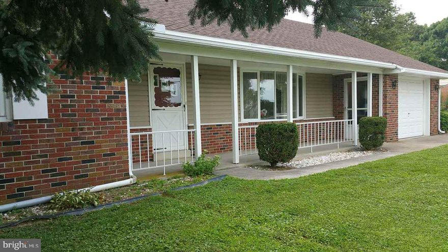 Solid brick home in Spring Grove SD on half an acre in the country! Maintenance free exterior, new roof in 2016. Very well maintained, beautiful hard wood floors under carpet in living room, hallway and all 3 bedrooms. Large 20X40 garage/work shop with electric, plenty of room for toys! New central vac. Tractor, snow blower and pool table included in the sale. Home is an estate and being sold "as is" inspections for buyers knowledge only.