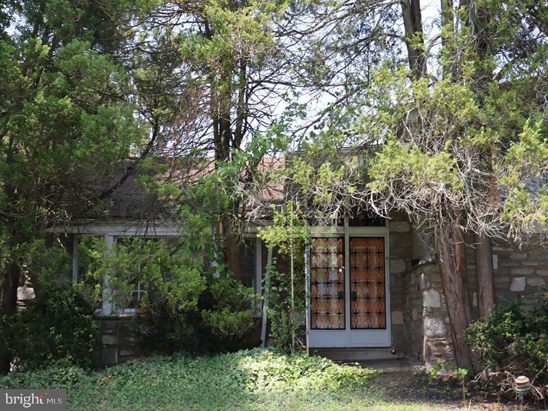 Fantastic Opportunity and potential! This charming two-story brick split-level home, built in 1961, offers timeless appeal with lots of space just waiting for your vision. Step into an oversized foyer that welcomes you into a bright and expansive living room, formal dining area, kitchen, and convenient laundry room. Upstairs, you'll find a primary bedroom with bath, along with three additional bedrooms and a full 3-piece hall bathroom.
The finished basement adds even more living space with a cozy fireplace, powder room, and walk-out access to a rear patio and pool/ yard area. Additional highlights include an attached garage and a prime location in a picturesque suburban neighborhood, offering both tranquility and a short, convenient commute to Philadelphia.