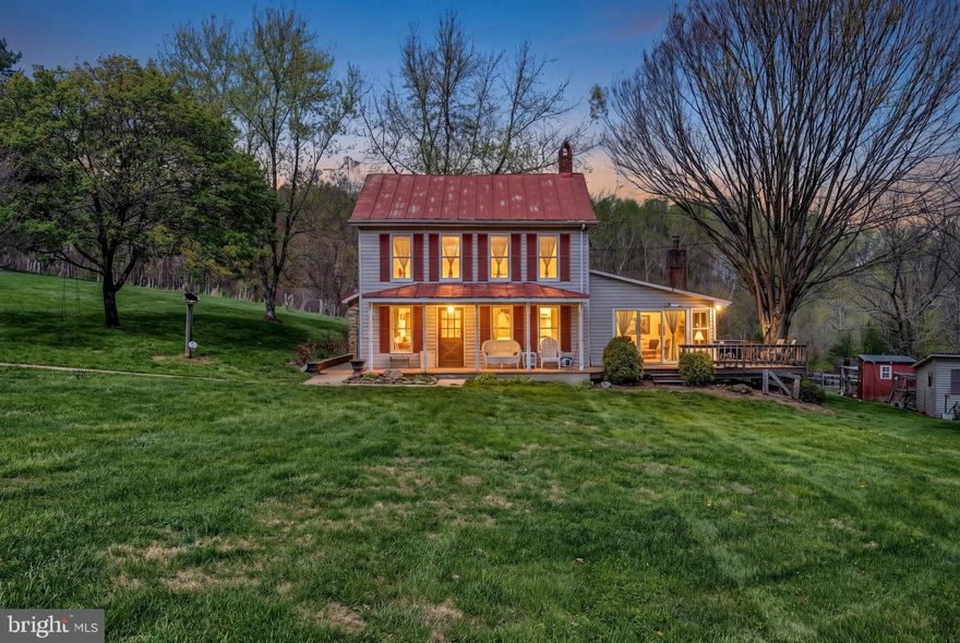 Nestled on a sprawling 20-acre estate, this charming farmhouse exudes warmth and character.  It is a restored 1850’s  Log Fsrmhouse.The interior boasts original hardwood flooring throughout, creating a seamless flow between the cozy family room and the country-style kitchen, perfect for gatherings. Mud room with laundry on first floor off the kitchen. And a huge Family room with vaulted ceilings and lots of windows for family entertainment. The view overlooks the stocked pond and a gentle stream, offering a picturesque backdrop. The property includes 20 acres, at the end of a road which means you have privacy and a connection to nature. A 4 car 32x28 detached garage with heat, water and electric(30 amp).  35x46 bank barn with water and electric, and a 1/4 ac stocked pond and 2 streams! You even have a deer blind ready to use!  The property has wild turkey, deer and could come with 2 chickens, 2 sheep , a tractor and generator. You could start your homestead here!