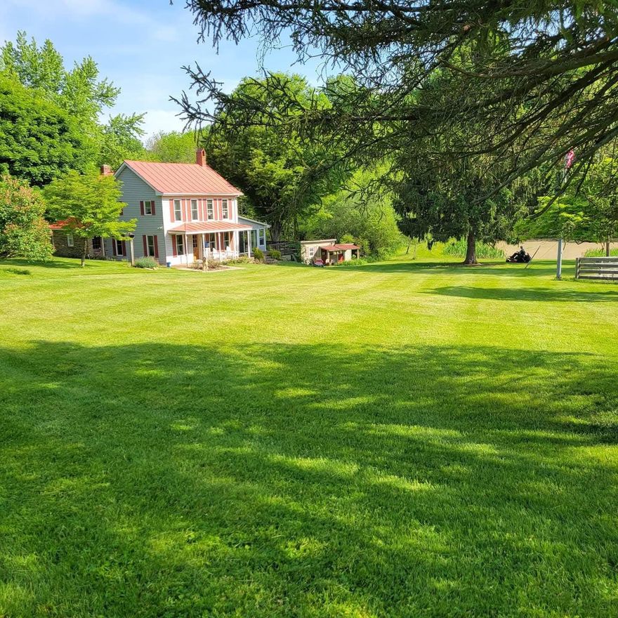 Nestled on a sprawling 20-acre estate, this charming farmhouse exudes warmth and character.  It is a restored 1850’s  Log Fsrmhouse.The interior boasts original hardwood flooring throughout, creating a seamless flow between the cozy family room and the country-style kitchen, perfect for gatherings. Mud room with laundry on first floor off the kitchen. And a huge Family room with vaulted ceilings and lots of windows for family entertainment. The view overlooks the stocked pond and a gentle stream, offering a picturesque backdrop. The property includes 20 acres, at the end of a road which means you have privacy and a connection to nature. A 4 car 32x28 detached garage with heat, water and electric(30 amp).  35x46 bank barn with water and electric, and a 1/4 ac stocked pond and 2 streams! You even have a deer blind ready to use!  The property has wild turkey, deer and could come with 2 chickens, 2 sheep , a tractor and generator. You could start your homestead here!