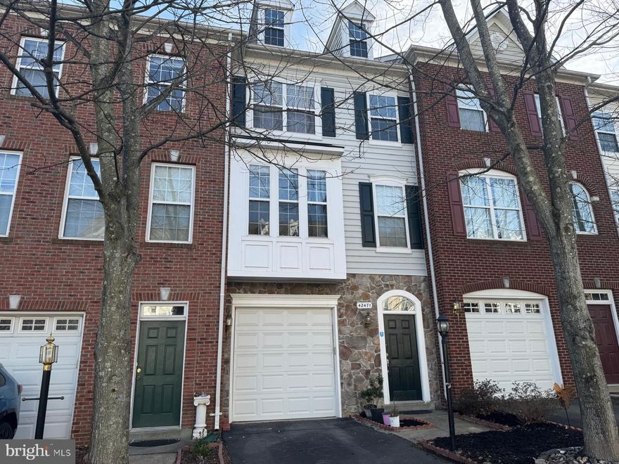 This beautifully maintained three-bedroom, three-and-a-half-bath townhome spans three fully finished levels and is located in the highly desirable Brambleton community, just steps from the Brambleton Town Center. Enjoy walkable access to restaurants, shops, a movie theater, Harris Teeter, the new Loudoun County Library, and more.

The main level features an inviting, light-filled living space and an open-concept kitchen and dining area complete with granite countertops, stainless steel appliances, a center island with seating, and a large pantry. The upper level offers a spacious primary suite with an updated en-suite bath, dual vanities, and a walk-in closet, along with two additional bedrooms, a full hallway bath, and a conveniently located laundry room.

The lower level opens to a newly installed patio and includes a third full bathroom and a versatile bonus room with a fireplace—ideal for a guest suite, home office, or recreation space. Recent updates include a new roof and HVAC system (2018), laminate flooring and carpet (2021), updated bathrooms (2021), kitchen appliances (2021), and washer and dryer (2021).

This Middleton model also features a one-car garage. The Brambleton HOA includes high-speed internet, cable, and access to exceptional amenities such as pools, playgrounds, walking trails, and multiple sports courts.