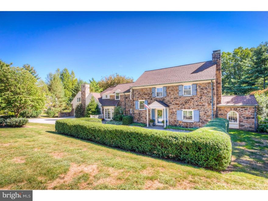 This picturesque stone colonial is the house people have driven by for years saying "I'd like to live there!". You'll want to move in, and enjoy living, on one of Northside Bryn Mawr's most desirable streets. Totally  updated and professionally decorated, this Stone Colonial Farmhouse has a relaxed sophistication and easy flow that can only be found in a truly classic Main Line home. The main level with its gleaming hardwood floors has a Foyer with views into the sunlit Dining and gracious Living Rooms, and invites you to enjoy the wonderful features this home has to offer. Beautiful millwork, 3 fireplaces,  built- in cabinetry and French doors from almost every 1st floor room are just a few of the amenities that the popular Wallace and Warner construction can offer. Tucked behind the living room is a cozy office with unique arched window. No architectural detail has been overlooked - custom kitchen cabinetry and aged brick floors are the perfect backdrop for the chef's kitchen which includes commercial grade gas ovens and range. The large granite island easily sits four or more. Just off the Kitchen is an inviting Family Room with fireplace and French Doors overlooking the bucolic rear yard. Additionally there is a quaint Powder Room with exposed stone detail. The Second floor Master Bedroom with brick fireplace and a brilliantly designed Marble Bath provides a perfect retreat after a long day. Two Bedrooms share a Jack & Jill bath, the 4th Bedroom, off of the back stairs, has its own full bathroom. The 3rd floor offers private living space with a Bedroom, Full Bath and Loft Style Office. Above the Oversized Garage is a Second Family Room with a Partial Bath. In addition to a Private Entrance, this room has its own HVAC system and would be perfect for a Guest/In-Law suite, Office or Gym. There are 2 Laundry Areas, one in the basement and one on the second floor. The lower level Basement also includes a work-out  room which is cable-ready making your exercising moments that much more enjoyable. New roof in 2015 and new 1st Floor A/C in 2015. Freshly painted throughout. Conveniently located to shopping, transportation and award winning schools!