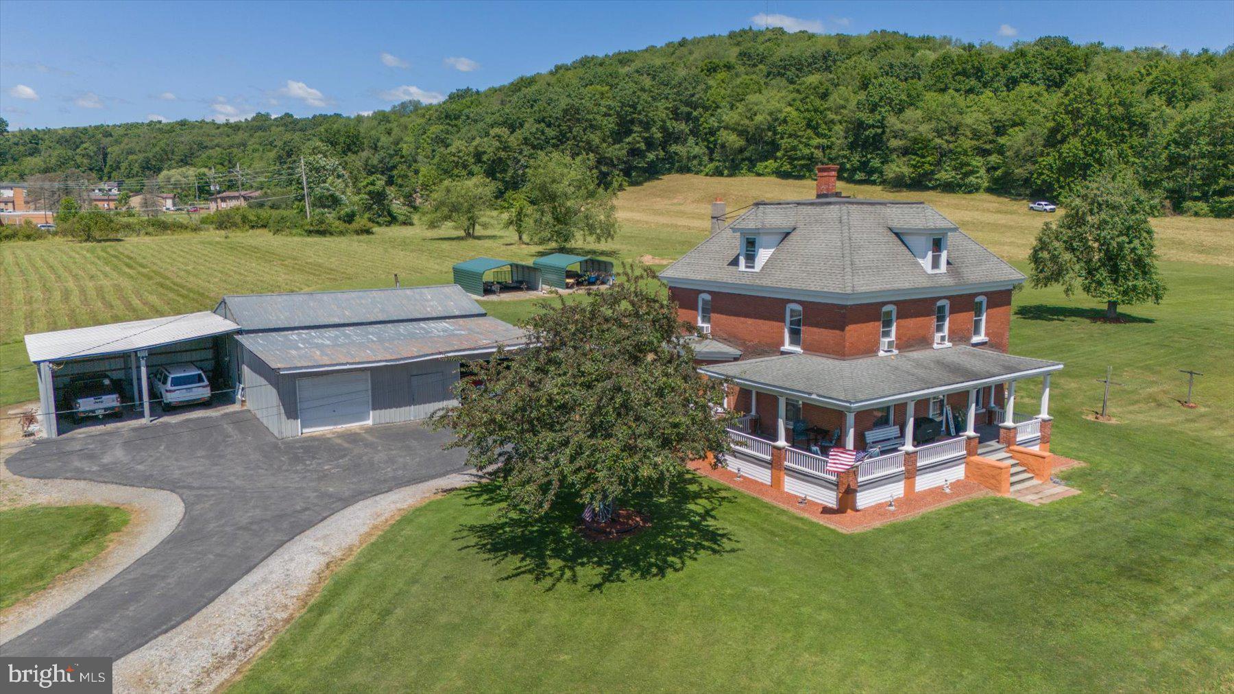 2 story brick home with 4 bedrooms, 2 baths and 29 acres overlooking Hyde all with in 1 mile of the Clearfield High School and Clearfield Country Club. Home is in outstanding condition and offers the warmth and charm of yesteryear. Picture perfect setting for a horse farm or beef. Property offers 29 acres of mostly open fields with a very nice wooded buffer to the rear. Supporting outbuilding includes a bank barn, large workshop/garage area and several carports. Property has 2 nice flowing spring that would offer a very good supply for watering a garden/greenhouses or tree farm. House has a wrap around porch over looking the lower pasture area ideal for wildlife watching. Home has 2 heat sources to choose from, newer oil burner in basement or a detached coal burner in the workshop which heats the shop and house. large macadam apron around the garage area and parking area for house. Home is on well water and on site septic, however public water and sewer border the land. Property could easily be subdivided due to the fact that there is several public roads that support the site. 24 hours notice for showings