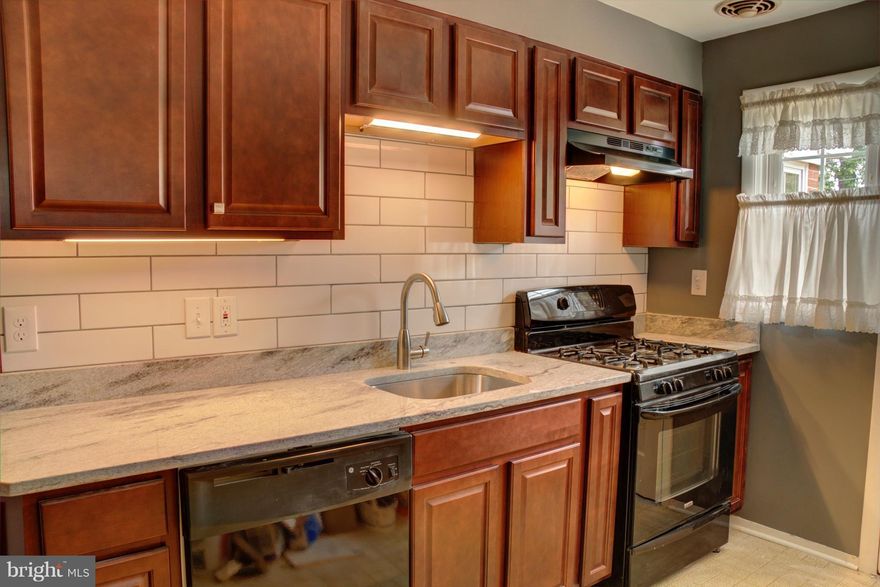 This home has just been updated with a new kitchen including granite, updated bathroom, carpet, doors, and rear deck.   This 3 bedroom, 1.5 bathroom home also has a young hvac unit, newer roof, and nice flat rear yard.   The basement is partially finished and could make an amazing media room, office, home gym, craft area or bonus room for your needs. The half bath and little niche also in basement