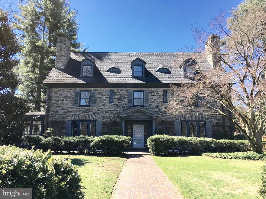 This classic 1911 Chestnut Hill stone Colonial Revival home has been very skillfully and tastefully renovated, top to bottom, in the past 5 years. Originally designed by noted local architects McGoodwin and Hawley for Dr. George Woodward, the traditional architectural character has been preserved and updated with a light, fresh, contemporary style that's perfect for today's buyers. Walls and a chimney were removed to create a gorgeous new, enlarged eat-in kitchen with adjacent butler's pantry and a new mudroom with custom cabinetry and heated floor. The kitchen features custom cabinets, oak floors, quartz counters, tile backsplash and high-end stainless steel appliances including a Wolf 6-burner stove, electric wall oven, warming drawer, and French-door fridge. The beautiful master suite has a bedroom with fireplace, sitting room (or dressing room or 5th bedroom), a renovated en-suite bath with marble vanity, soaking tub, and stall shower, plus a sunny office with gas fireplace. There are 3  additional, beautifully renovated bathrooms with white marble and ceramic tile, and a large 3rd-floor playroom.  The interior and exterior have been freshly painted, and all hardwood floors refinished. There is a new bluestone patio, new rear entrance with stone steps & landing, and new landscaping.  Updated electric (knob & tube wiring removed & replaced).  Central air (1st & 2nd floors only, with conduit in place for 3rd floor).  Wonderful, hidden flower & vegetable garden beds tucked behind the 3-car garage.  Perfect location - walk to Chestnut Hill shops, restaurants, parks, commuter train, schools & clubs.