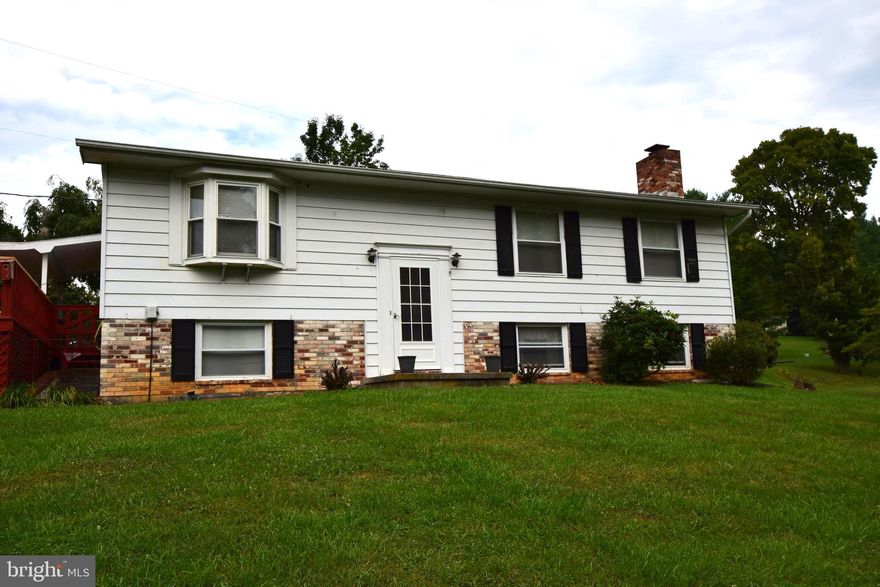 Well maintained 3BR 2.5 BA. split foyer on 1.27 ac. Lg. deck, two outbuildings. Full finished basement with vented gas log FP. Possible 4th BR.  in basement. Contingent on Seller finding suitable housing. 2 propane tanks rented from Holtzman Oil. Window AC to convey. New hot water heater. Community well.  2 Bedroom Septic Permit.