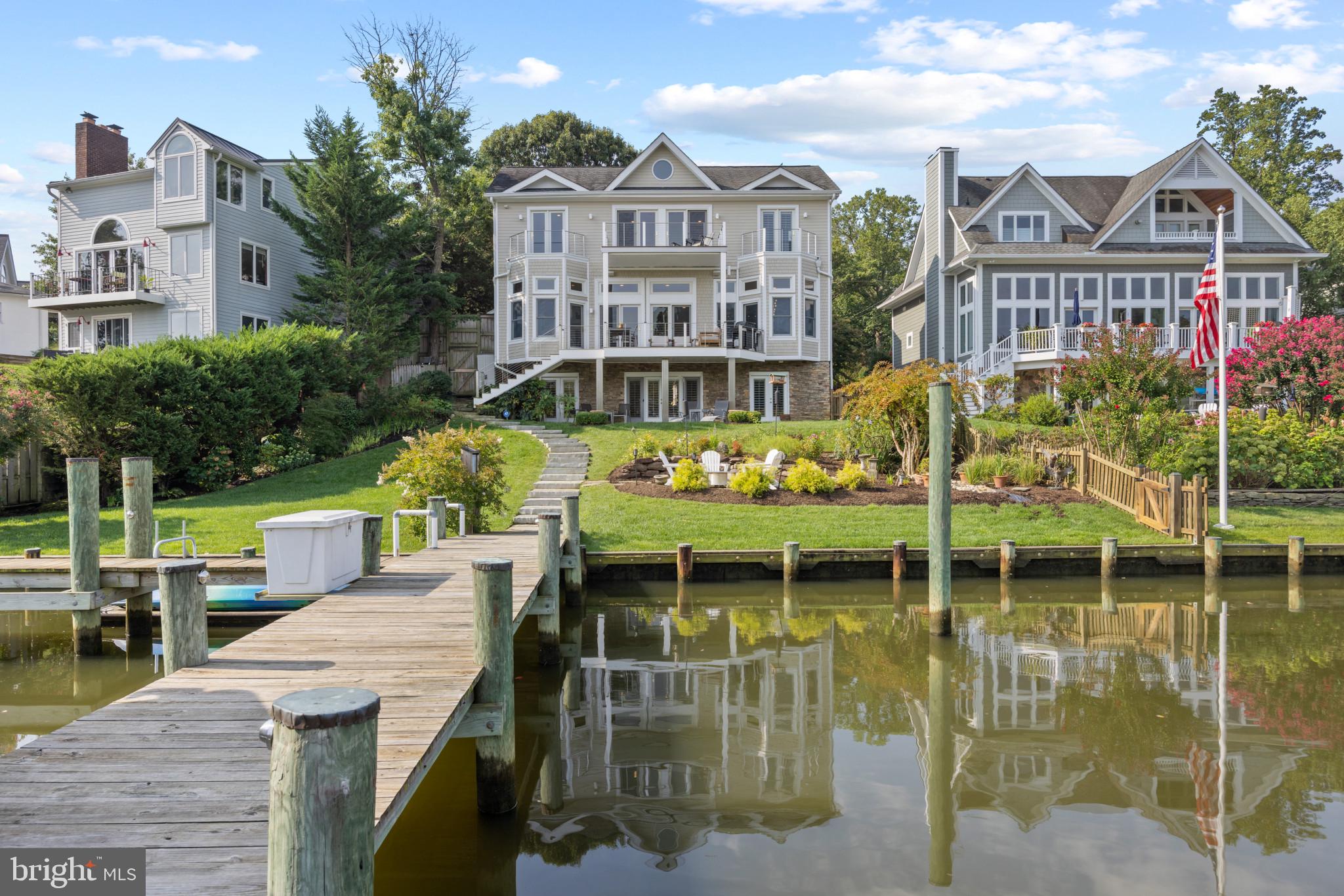 Exceptionally built custom waterfront home with spectacular panoramic views of Spa Creek. Enjoy the perfect vantage point for watching the Blue Angels performance, the 4th of July fireworks and all the activity up and down the creek. Attention to detail and high-end finishes are the hallmark of this wonderful home with 12 ft ceilings on the main level. Over 5,000 sqft of living space on 3 finished levels, 5 spacious bedrooms and 4 baths. The stunning Primary suite has a private balcony with panoramic views up and down Spa Creek and the luxurious spa-like bath is stunning in its simplistic design. An open floor plan throughout the home encourages indoor/outdoor living and draws you outside to relax on the spacious Ipe deck with modern stainless steel cable railing and elevated views of the water or encourage the party to spill out onto the custom stone patio below and the lush backyard that leads out to the pier that will be sure to please any boating enthusiast. A quick 5 minute drive to downtown Annapolis and Eastport and 2 minutes to the Truxon Park pickleball courts or grab a water taxi directly from your dock and head down Spa Creek right into Annapolis for a night out on the town or venture off to some of the Bay's best cruising and fishing areas. Annapolis offers the perfect balance of small-town charm and big world sophistication. Welcome Home!