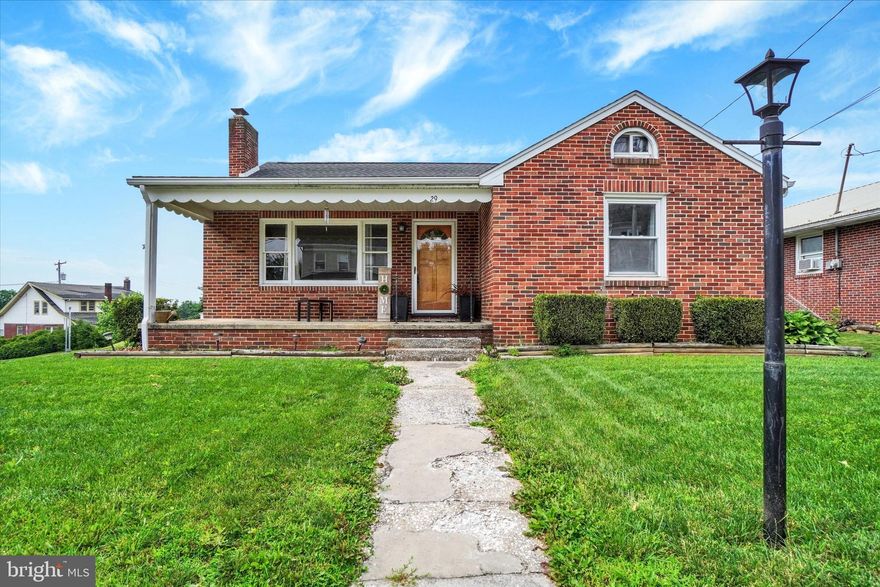 This charming ranch-style home is a well-maintained brick residence featuring 2 cozy bedrooms and a beautifully updated full bathroom with a walk-in shower, ensuring convenience for everyday living. Step inside to discover warm refinished wood floors that flow throughout the living spaces, complemented by ceramic tile in the kitchen area. The inviting combination kitchen/dining area is perfect for gatherings, while the back patio provides a refreshing space for outdoor cookouts on warm days. A delightful wood-burning fireplace adds a touch of warmth and ambiance, making it an ideal spot for relaxation. The home boasts an unfinished full basement and an open attic, offering ample storage or the potential for future expansion. The level rear yard provides a serene space for gardening or play with it's tall wooden privacy fence. Parking is a breeze with a detached 2-car garage and a paved driveway accommodating up to two more vehicles. Additional exterior features include thoughtful lighting that enhances the home's curb appeal. This property strikes a perfect balance between manageable upkeep and outdoor enjoyment. With the rail trail just minutes away, and commuting to Hanover or York a breeze, this home is in a convenient location for you!  This home is not just a place to live; it’s a place to create lasting memories. Don’t miss the opportunity to make it yours!